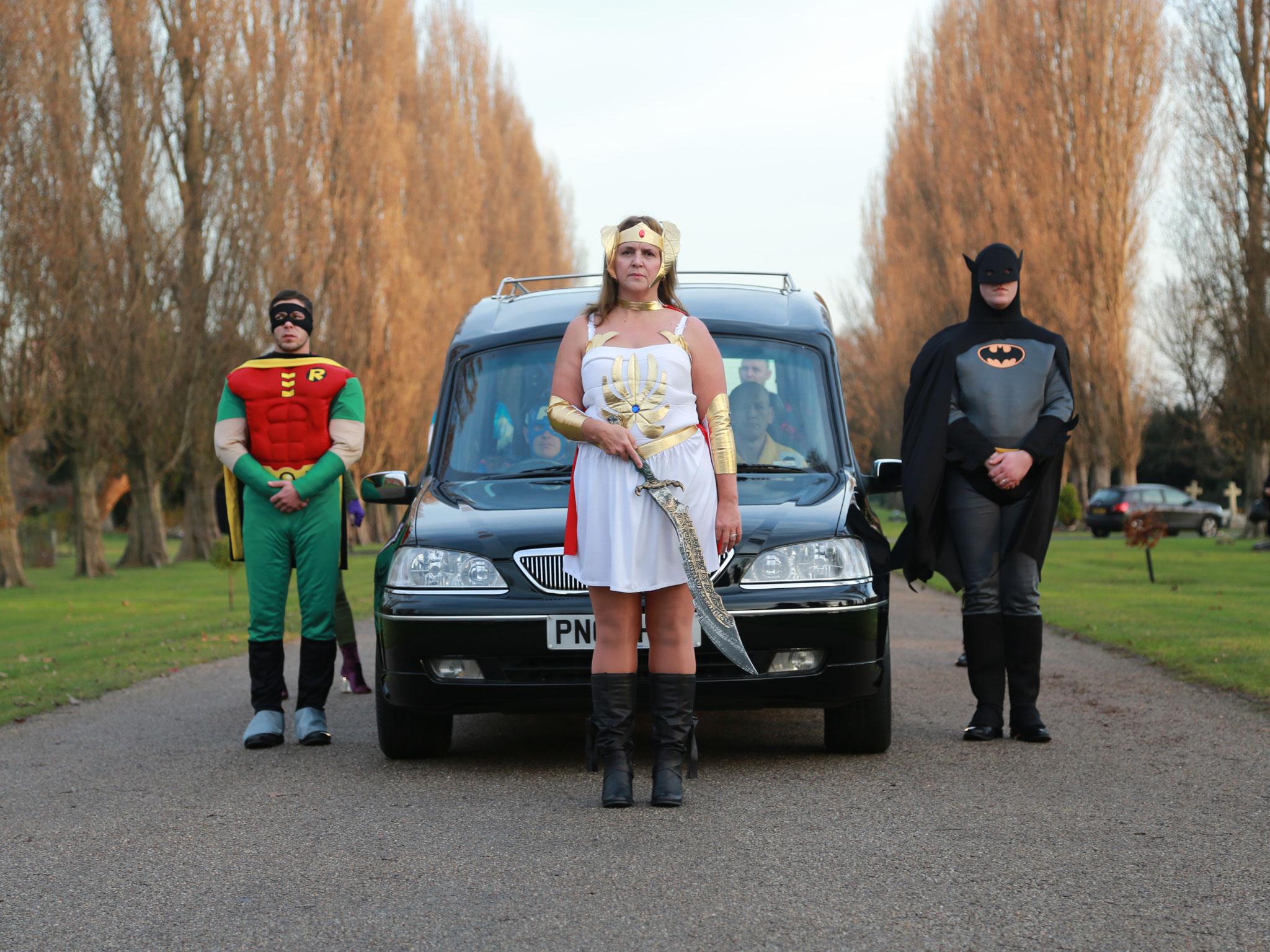 David Collingwood's colleagues take part in a super hero themed service