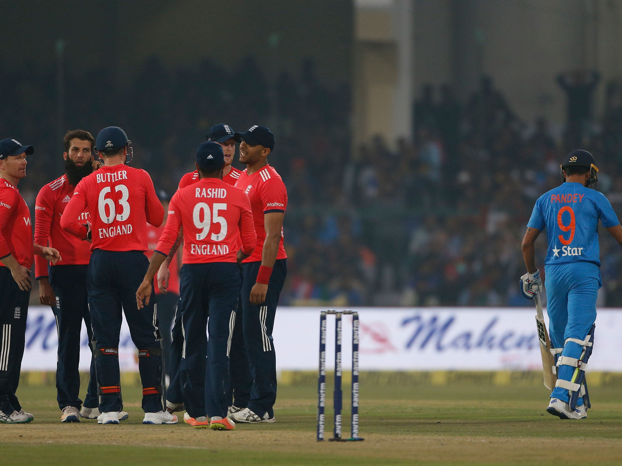 India's Manish Pandey leaves the ground after being dismissed by Moeen Ali during the first Twenty20 cricket match at Green Park stadium in Kanpur