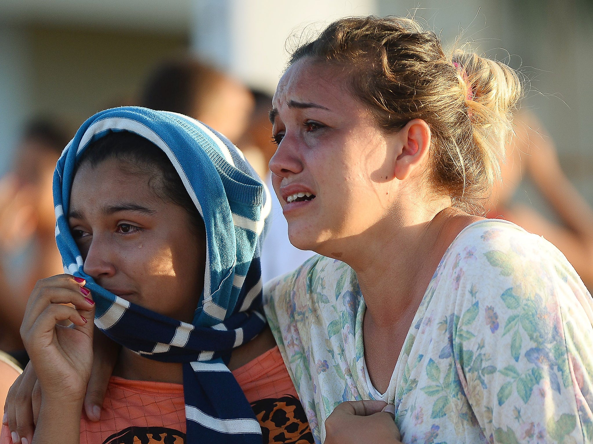 &#13;
Relatives of inmates wait for news outside Alcacuz after a fight between rival gangs left at least 30 prisoners dead &#13;