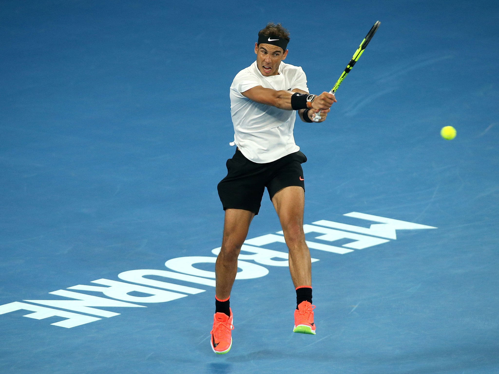 Nadal plays a shot in the fifth set against Dimitrov