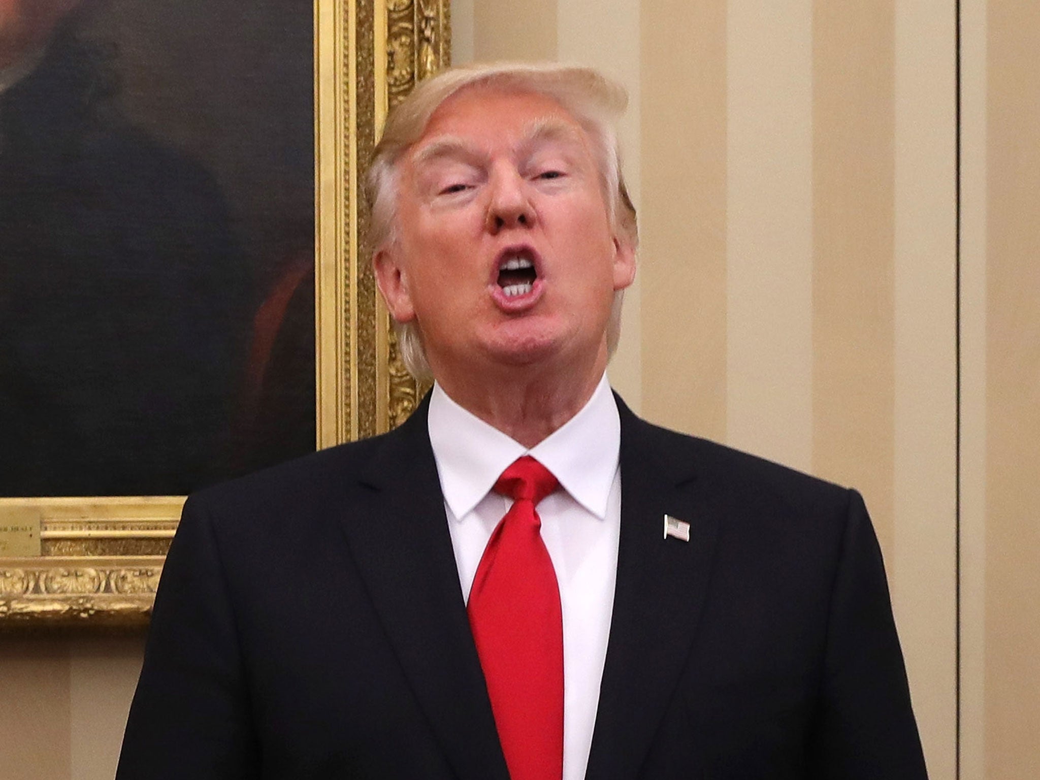 US President Donald Trump speaks in The Oval Office at The White House on January 27, 2017