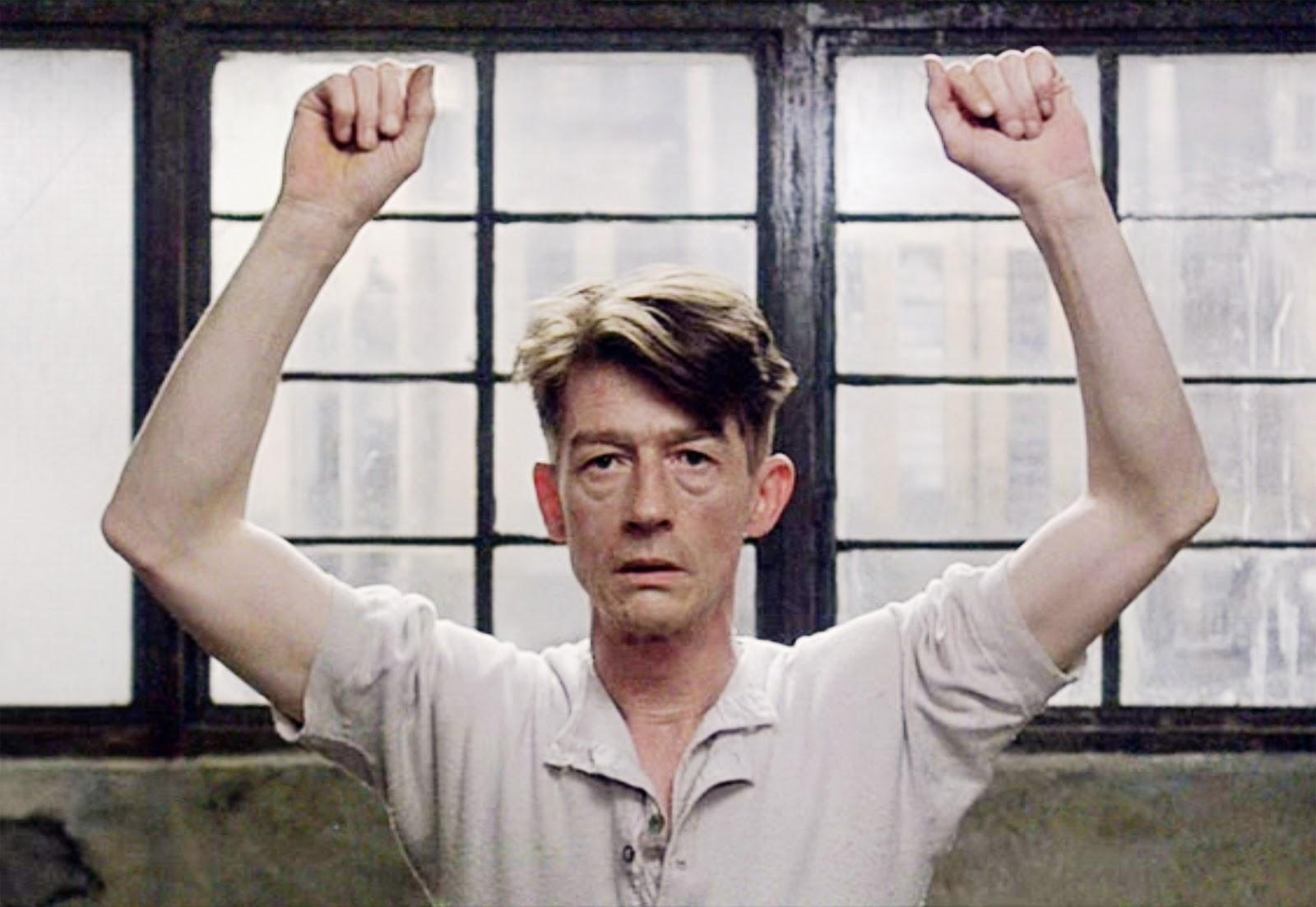 The late Sir John Hurt playing Winston Smith in Michael Radford's 1984 film adaptation of Orwell's novel