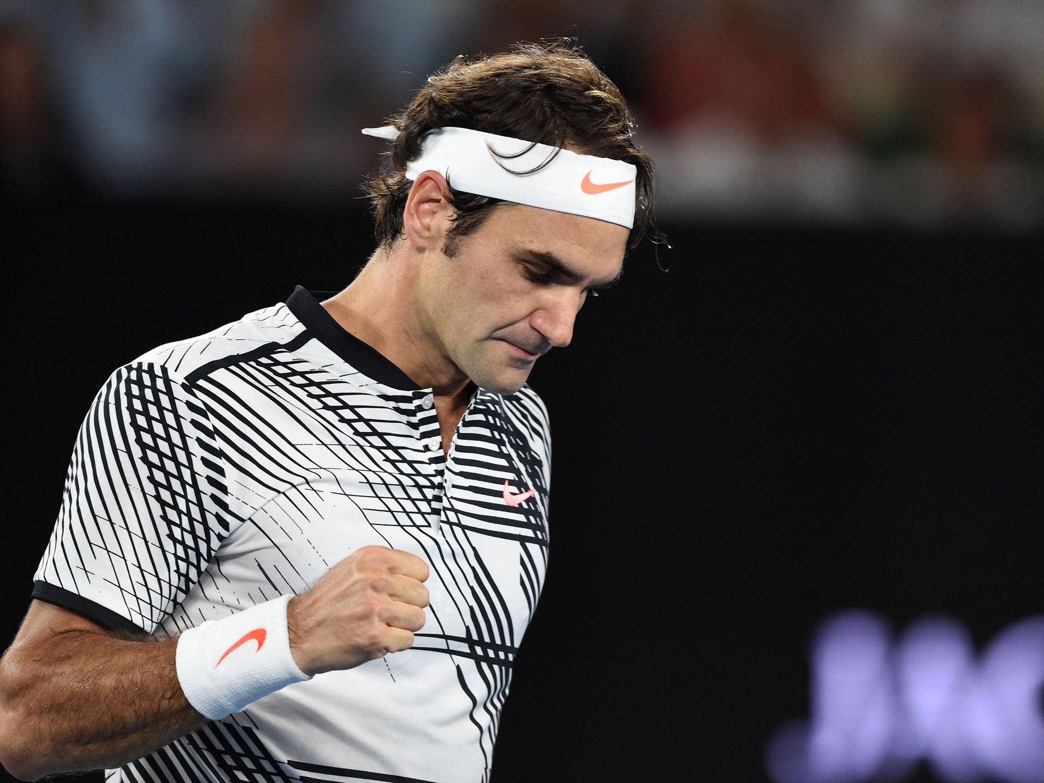 Federer celebrates after breaking his opponent's serve