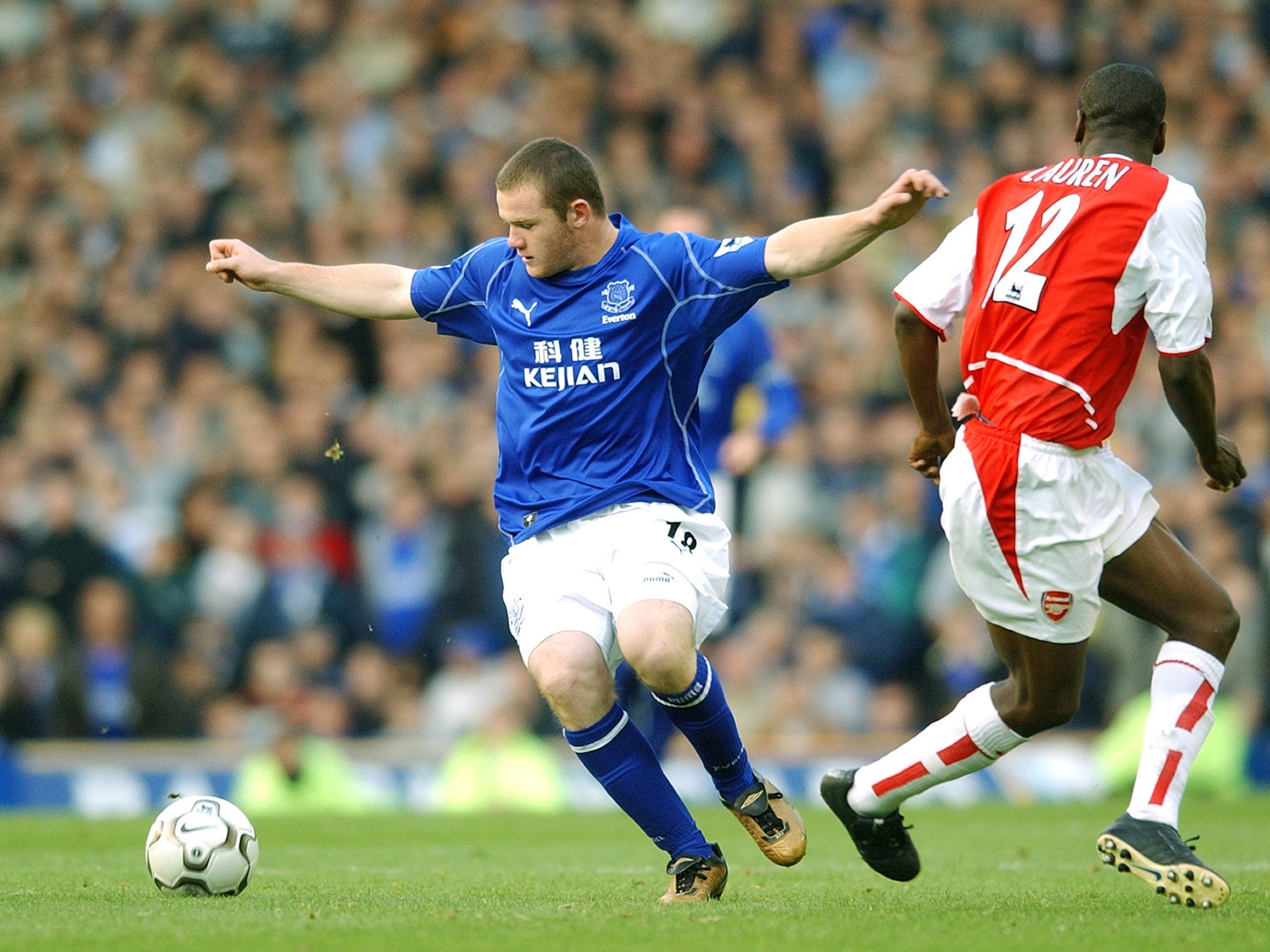 Lauren in action for Arsenal against a young Wayne Rooney