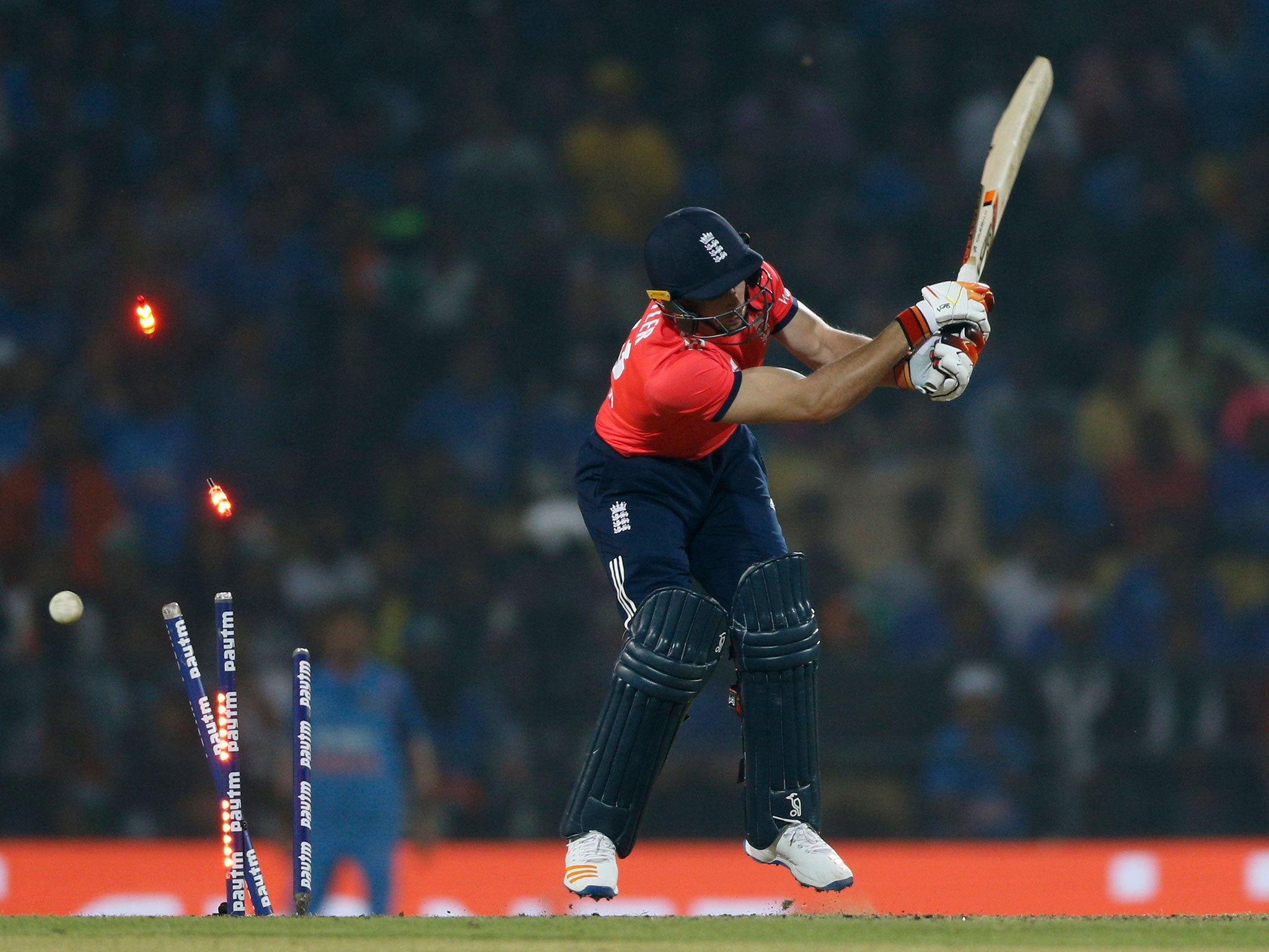 Jos Buttler is bowled by India's Jasprit Bumrah