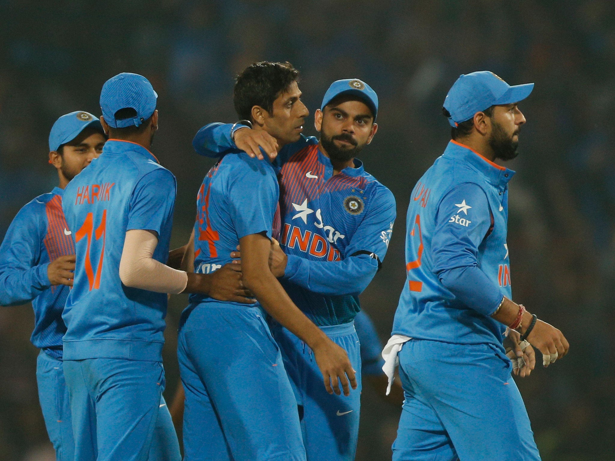 Virat Kohli celebrates with his team-mates after victory