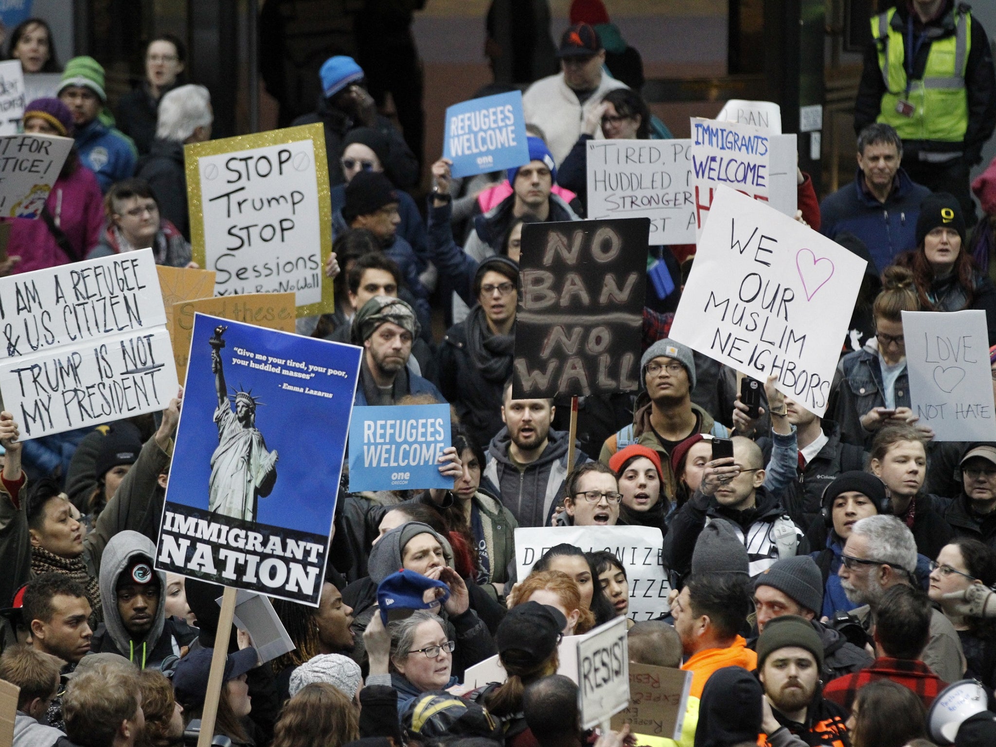 Activists gather at Portland International Airport to protest against President Donald Trump's executive action travel ban in Portland, Oregon