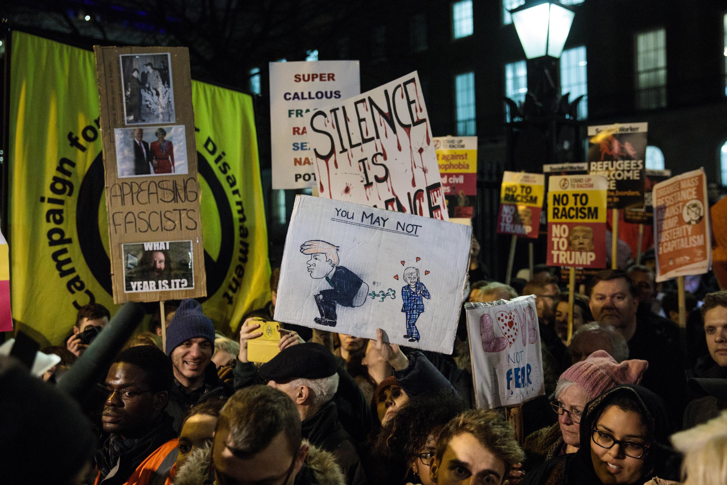 Protesters were out in full force on Monday demanding Theresa May cancel Donald Trump’s planned state visit