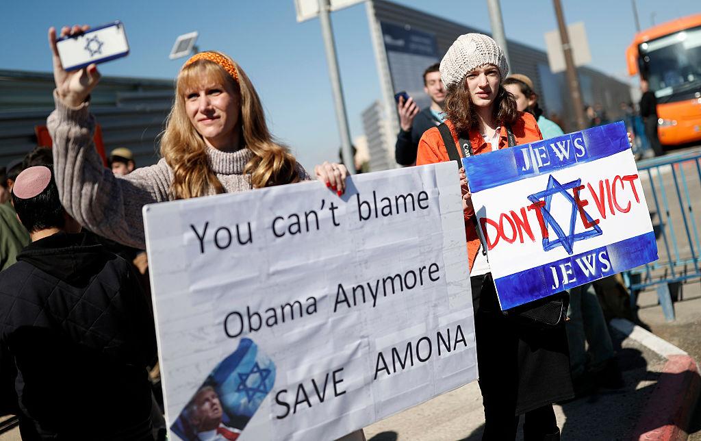 Israelis protest the demolition of Amona - a settlement outpost in the West Bank, which the High Court ruled must be evicted - on January 30 2017