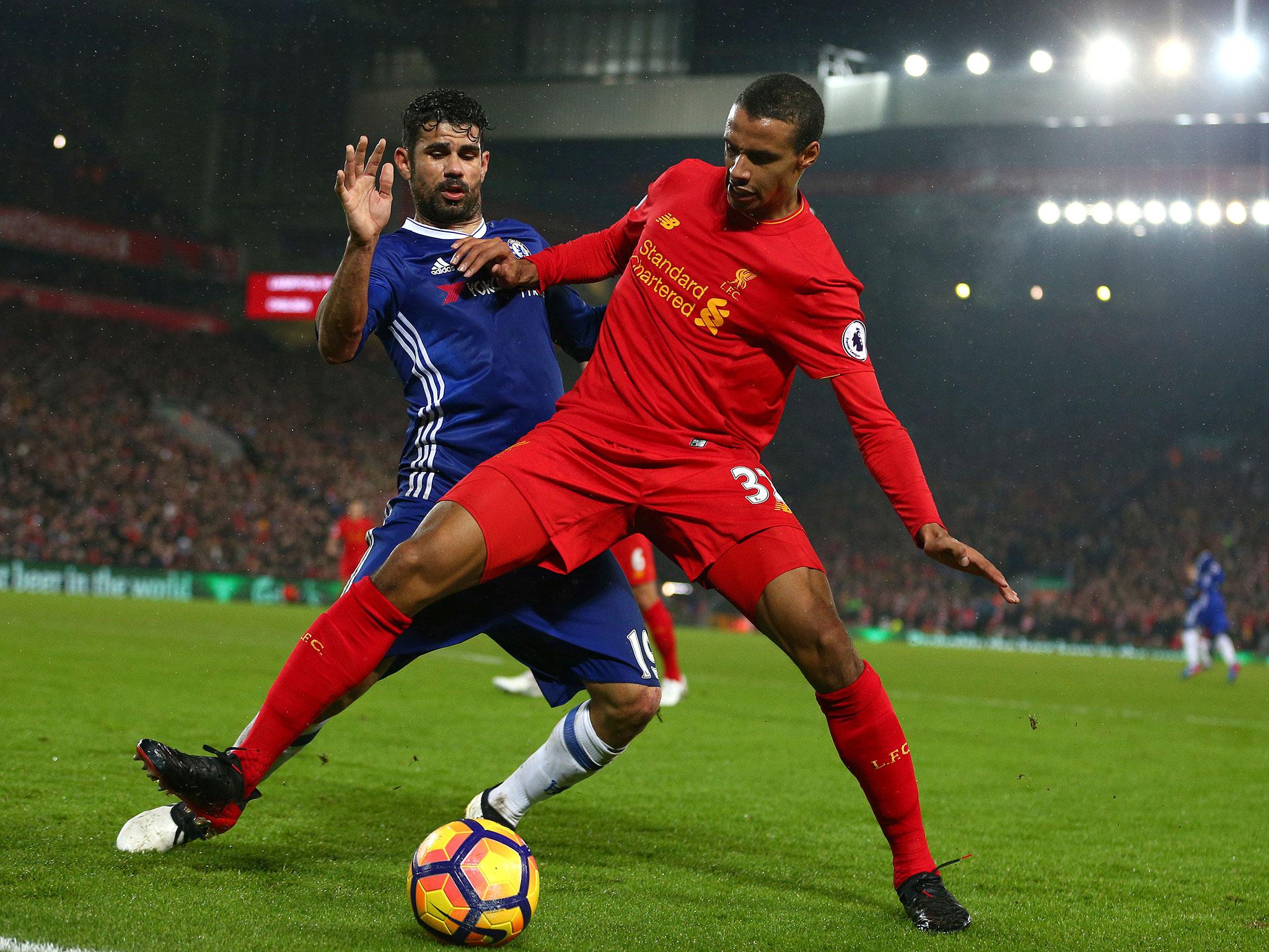 Joel Matip attempts to shield the ball from Costa (Getty)