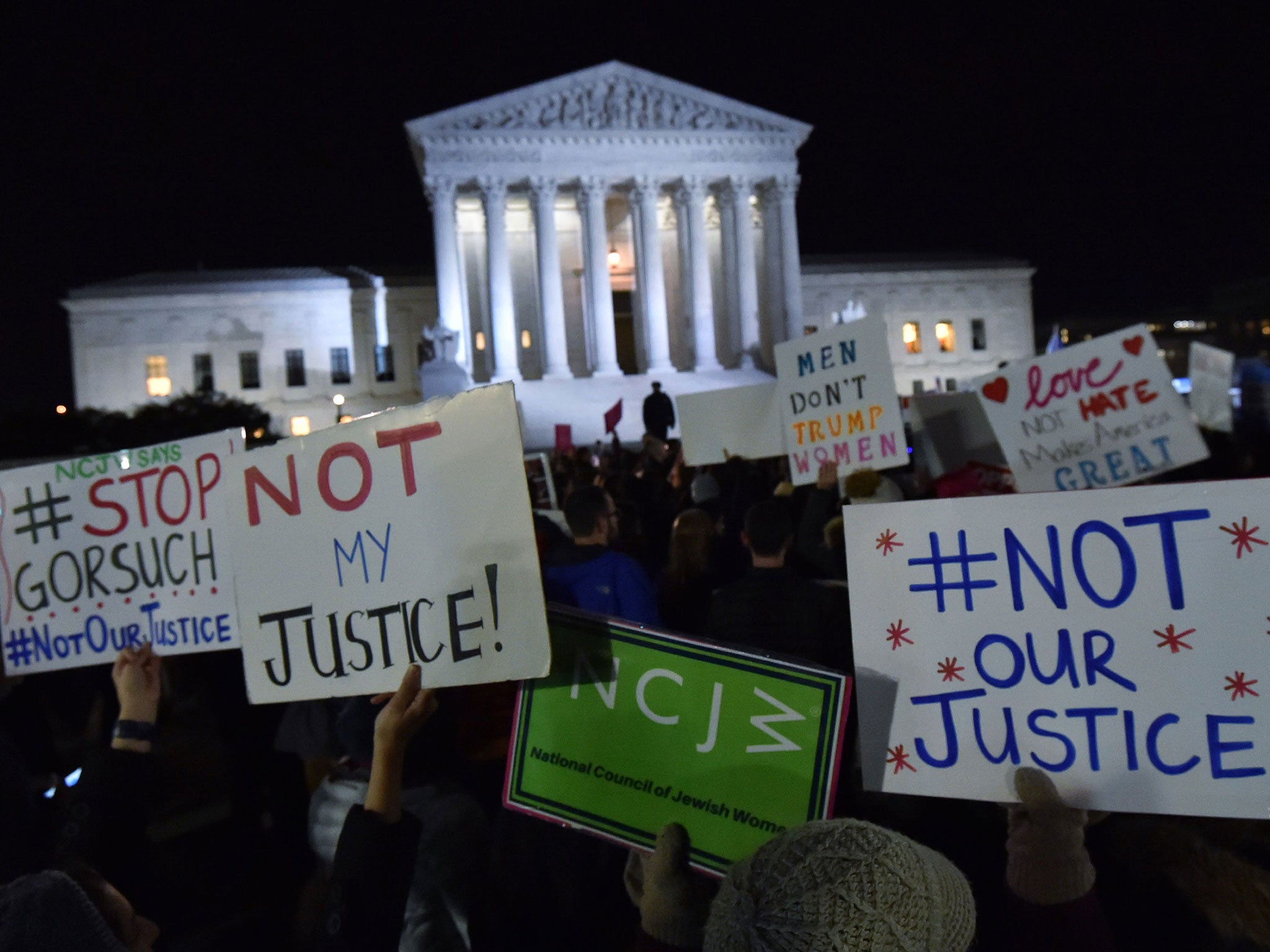 Demonstrators gather outside the US Supreme Court after Donald Trump announced Neil Gorsuch as his nominee to fill the seat Associate Justice of the Supreme Court on 31 January (AFP/Getty Images)