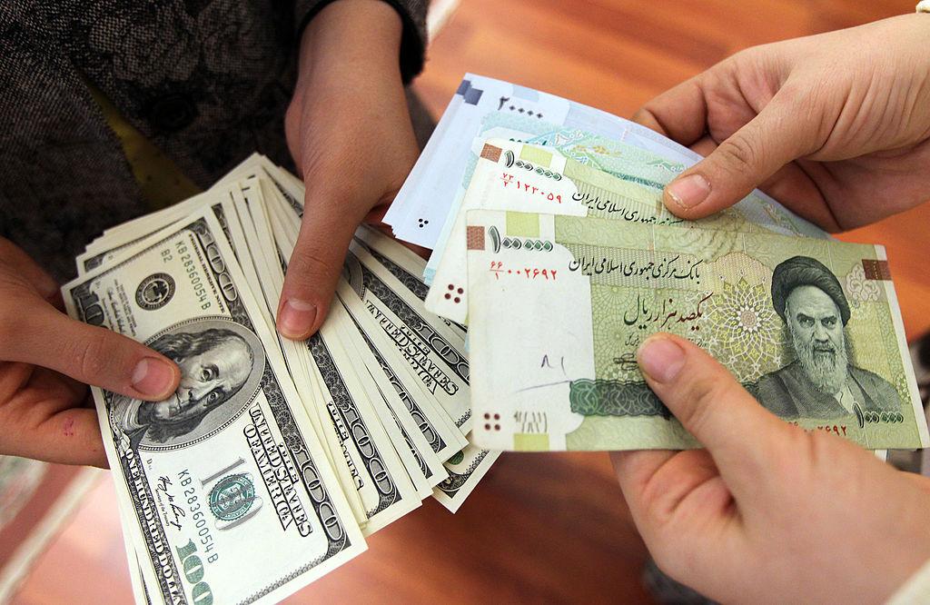 File photo of women counting money at a currency exchange in Tehran, Iran