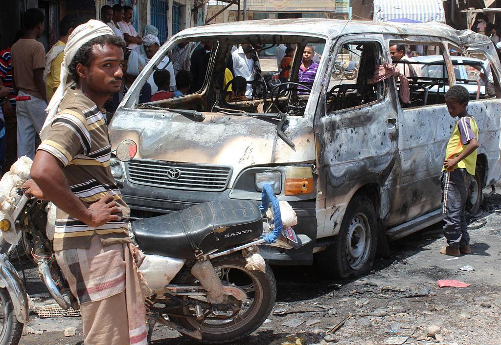 Yemenis gather around the site of an al-Qaeda attack in Huta on September 3 2016