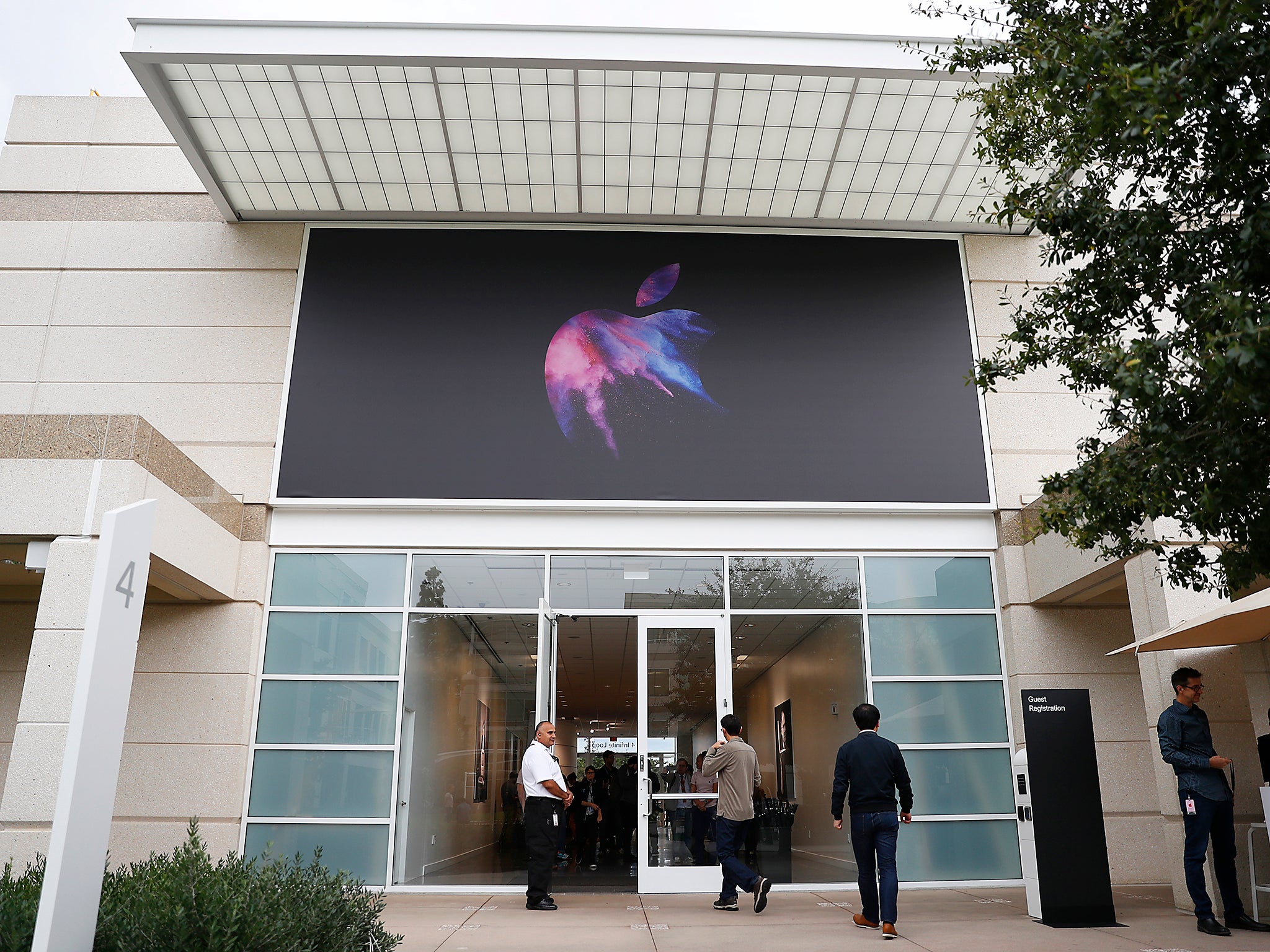 An Apple logo is seen on a building during a product launch event at Apple's headquarters in Cupertino, California