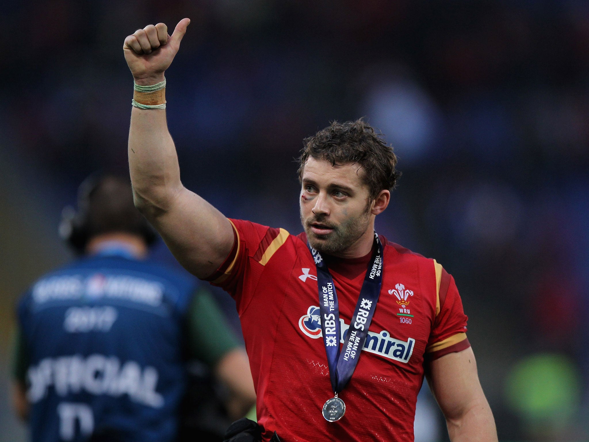 Leigh Halfpenny salutes the crowd after Wales's victory over Italy