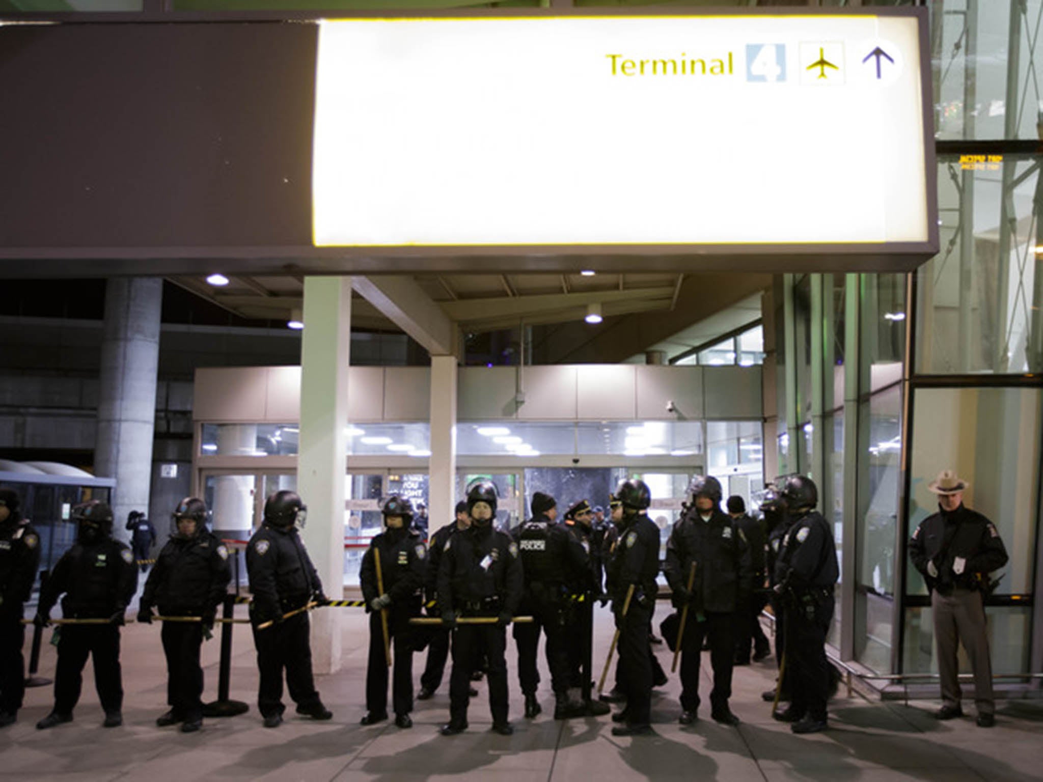 Police prepare for a protest against the travel ban at JFK international airport