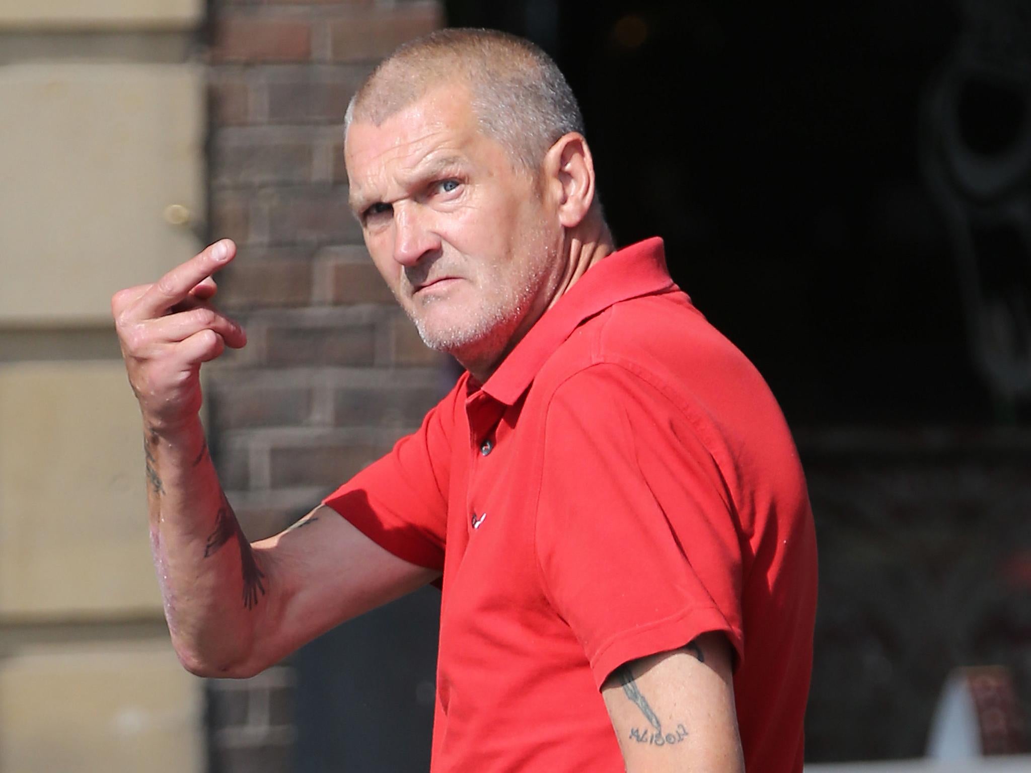 Peter Scotter gesturing to the media outside Newcastle Crown Court