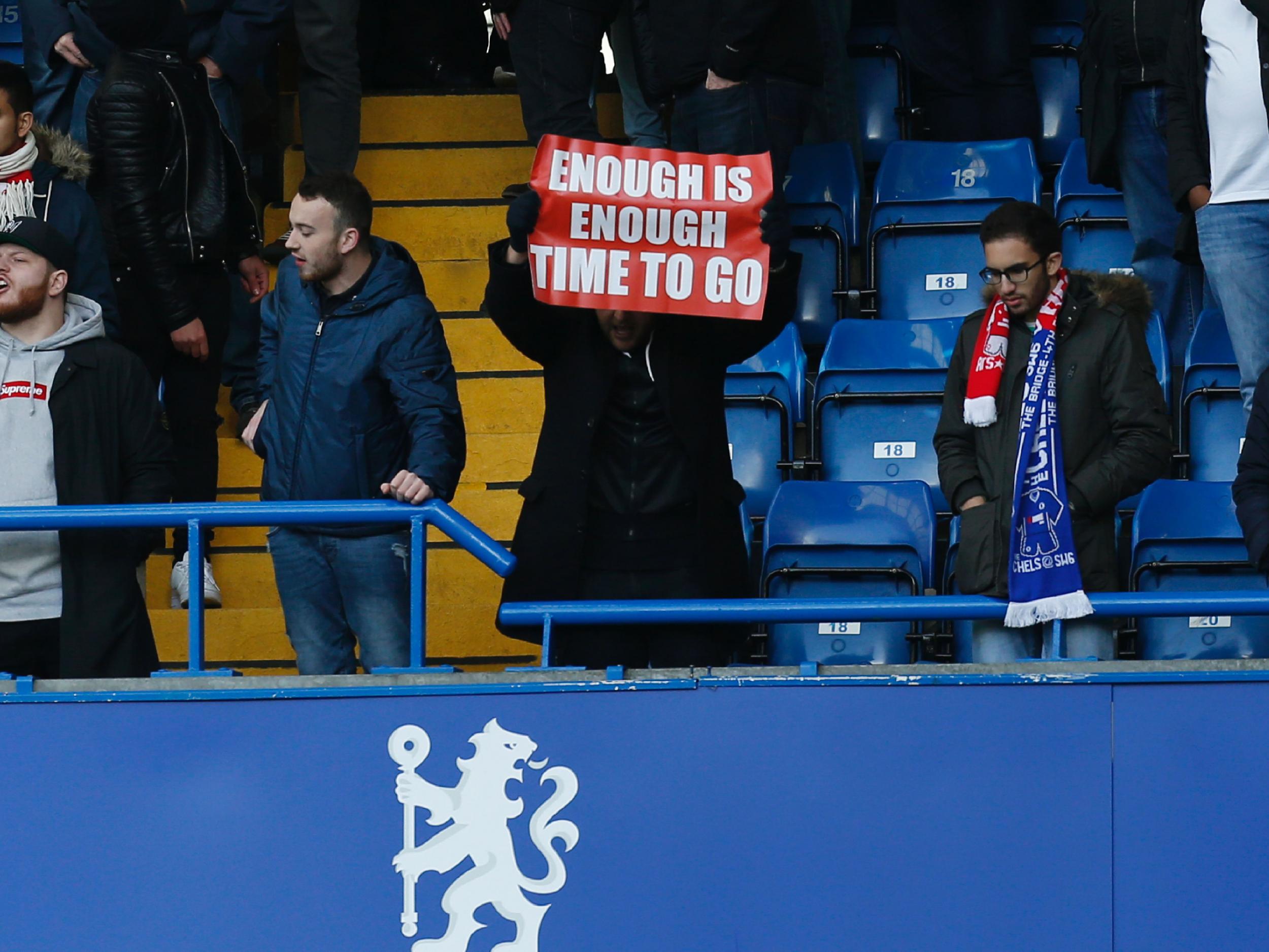 There were banners calling for Wenger to leave during the 3-1 defeat to Chelsea