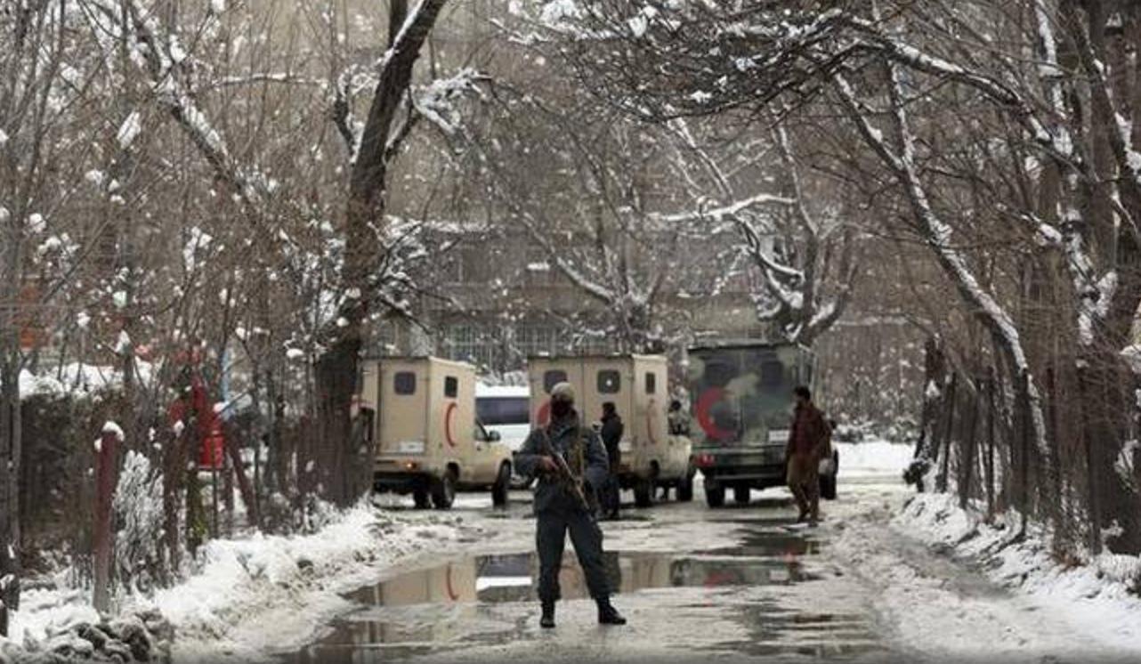 A member of the Afghan security forces stands guard near the scene of Tuesday's deadly attack on Kabul's Supreme Court on Tuesday February 7, 2017