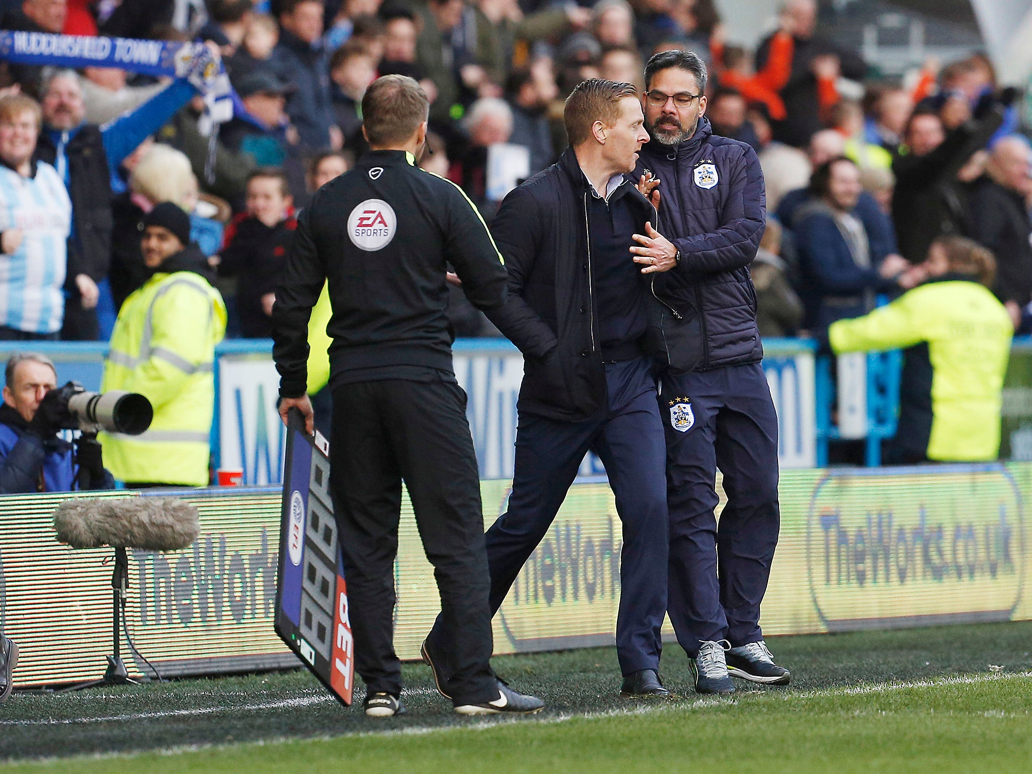 Leeds United Manager Garry Monk and Huddersfield Town Manager David Wagner clash before both being sent to the stands