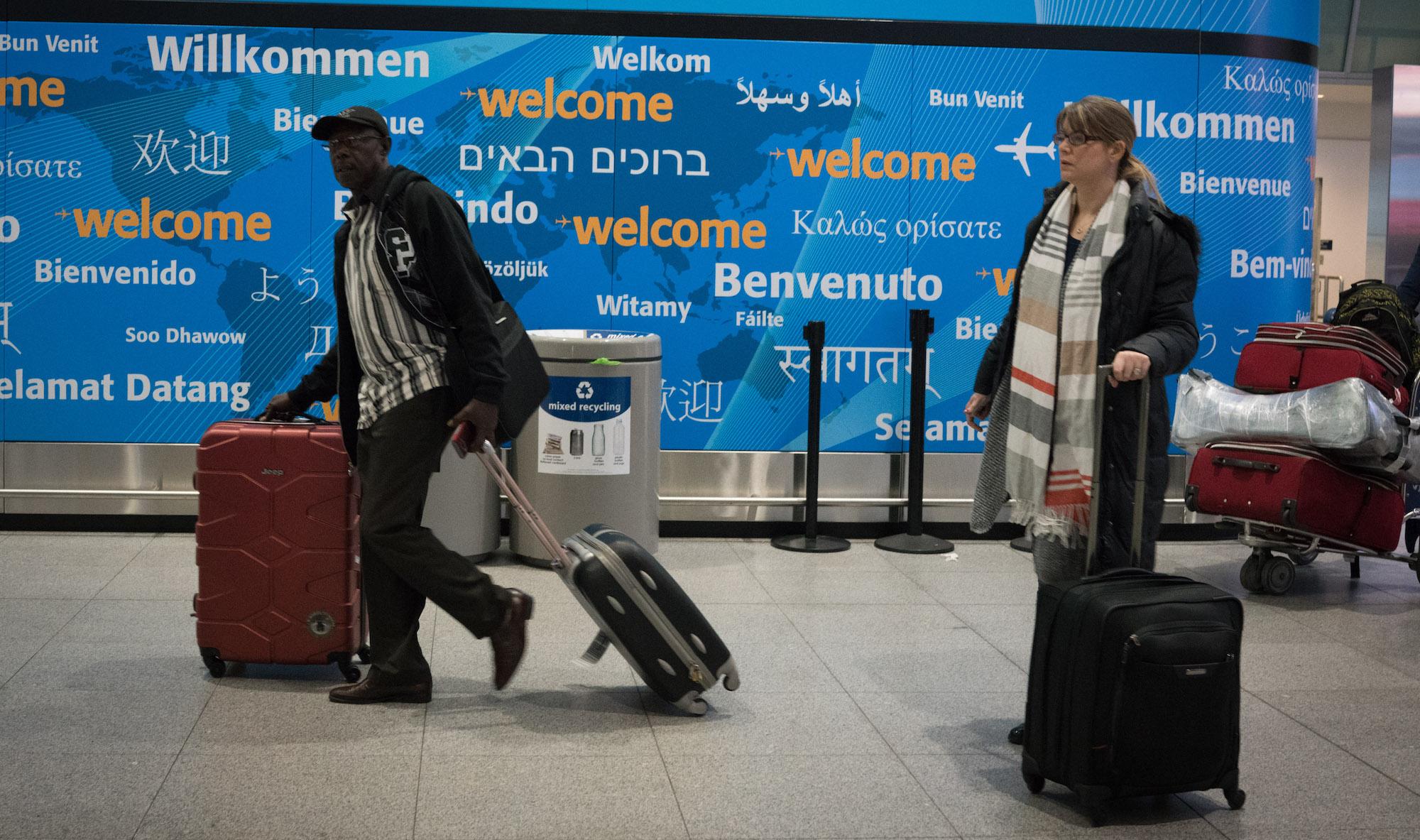 People arrive as volunteers at JFK International Airport's Terminal 4 are on hand to work with people that may have been detained from the seven countries under President Trump's executive order, February 4, 2017 in New York.