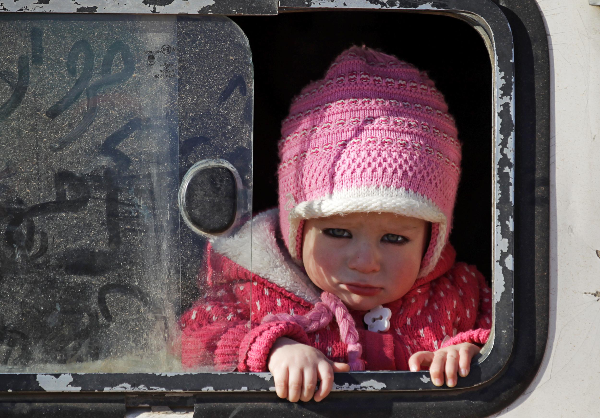 A child who was rescued from the Isis-controlled northern Syrian town of al-Bab