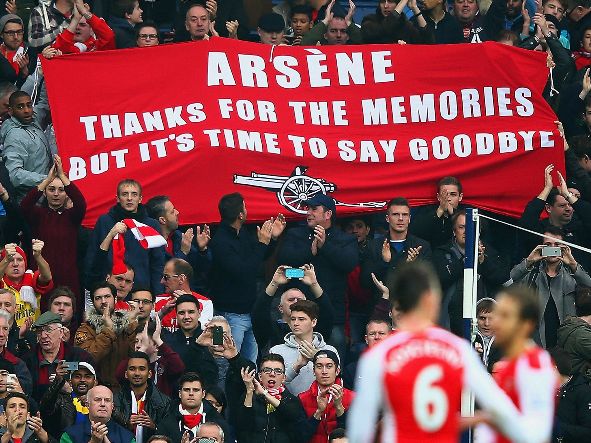 Arsenal supporters unfurl a banner in protest against Wenger's management during the 2015/16 season