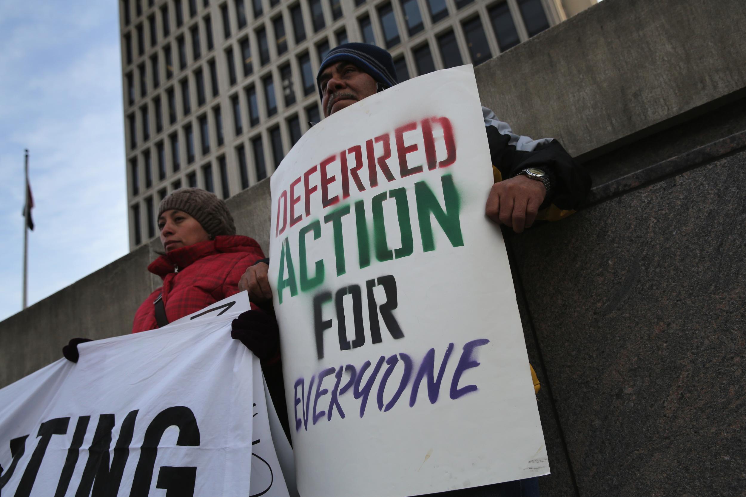 Immigrants attend a press conference for families facing deportation in Newark, New Jersey