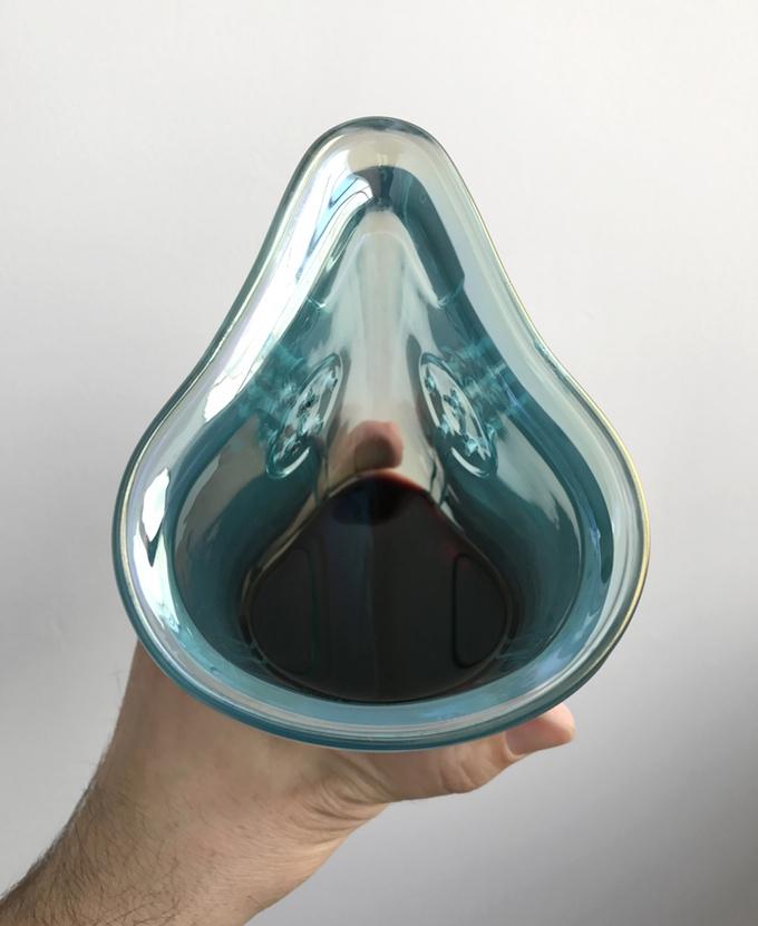 The glasses look sinisterly similar to a gas mask (Image: Wine Glass Mask)