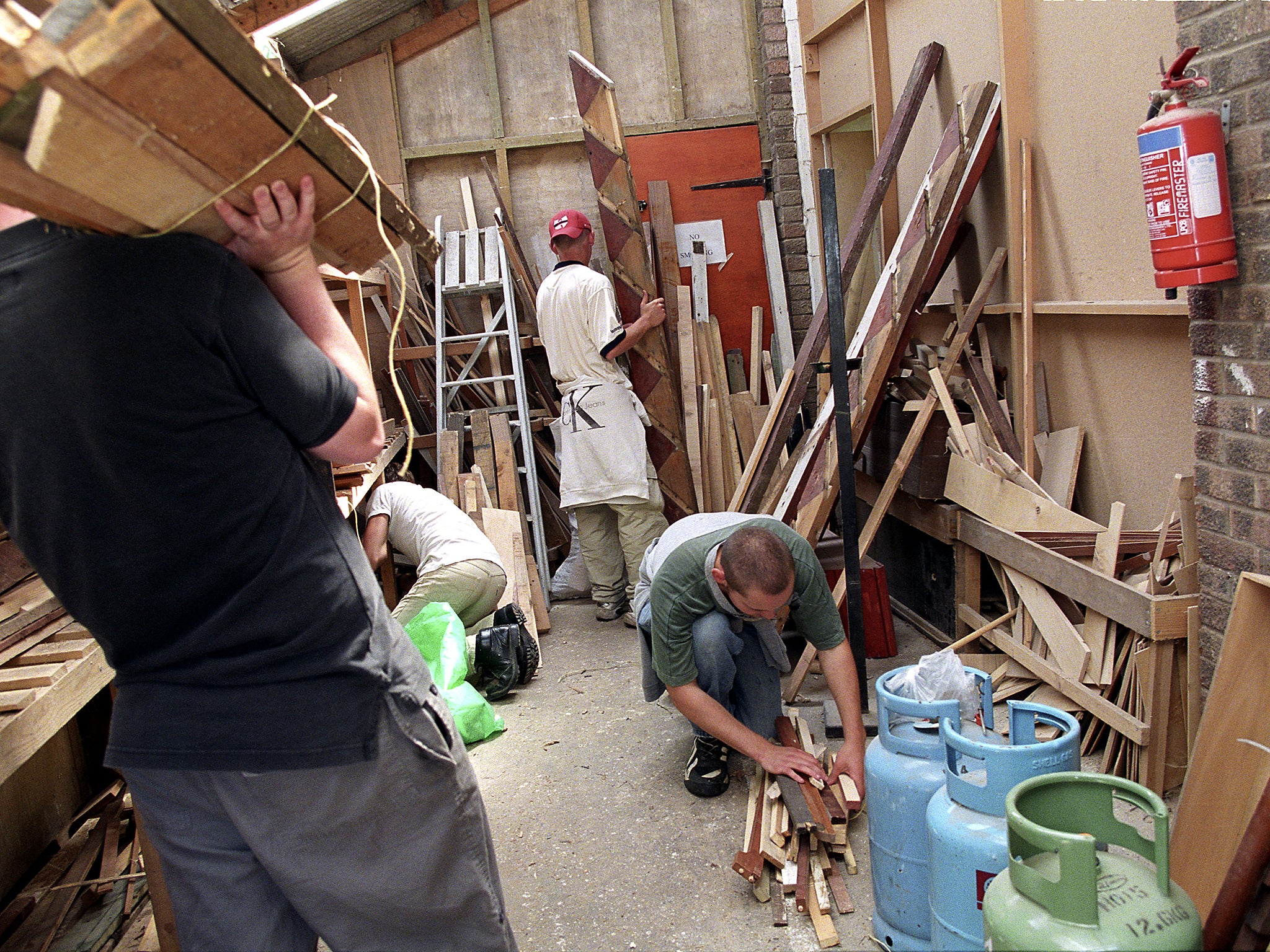 Young offenders doing construction work as community service