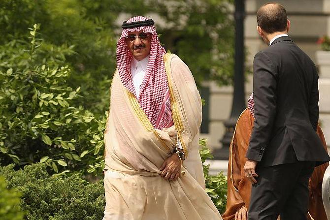 Crown Prince Mohammed bin Nayef is escorted as he arrives at the White House on May 13, 2015 in Washington, DC ahead of meetings with former President Barack Obama