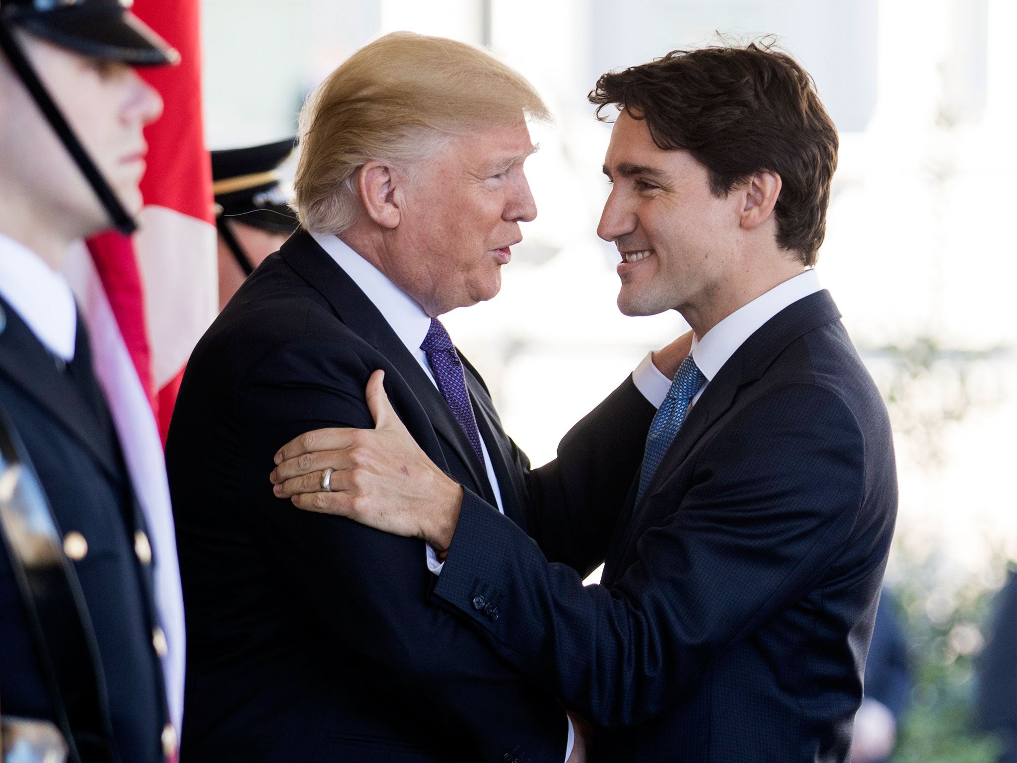 Donald Trump and Justin Trudeau embrace as the Canadian PM arrives at the White House