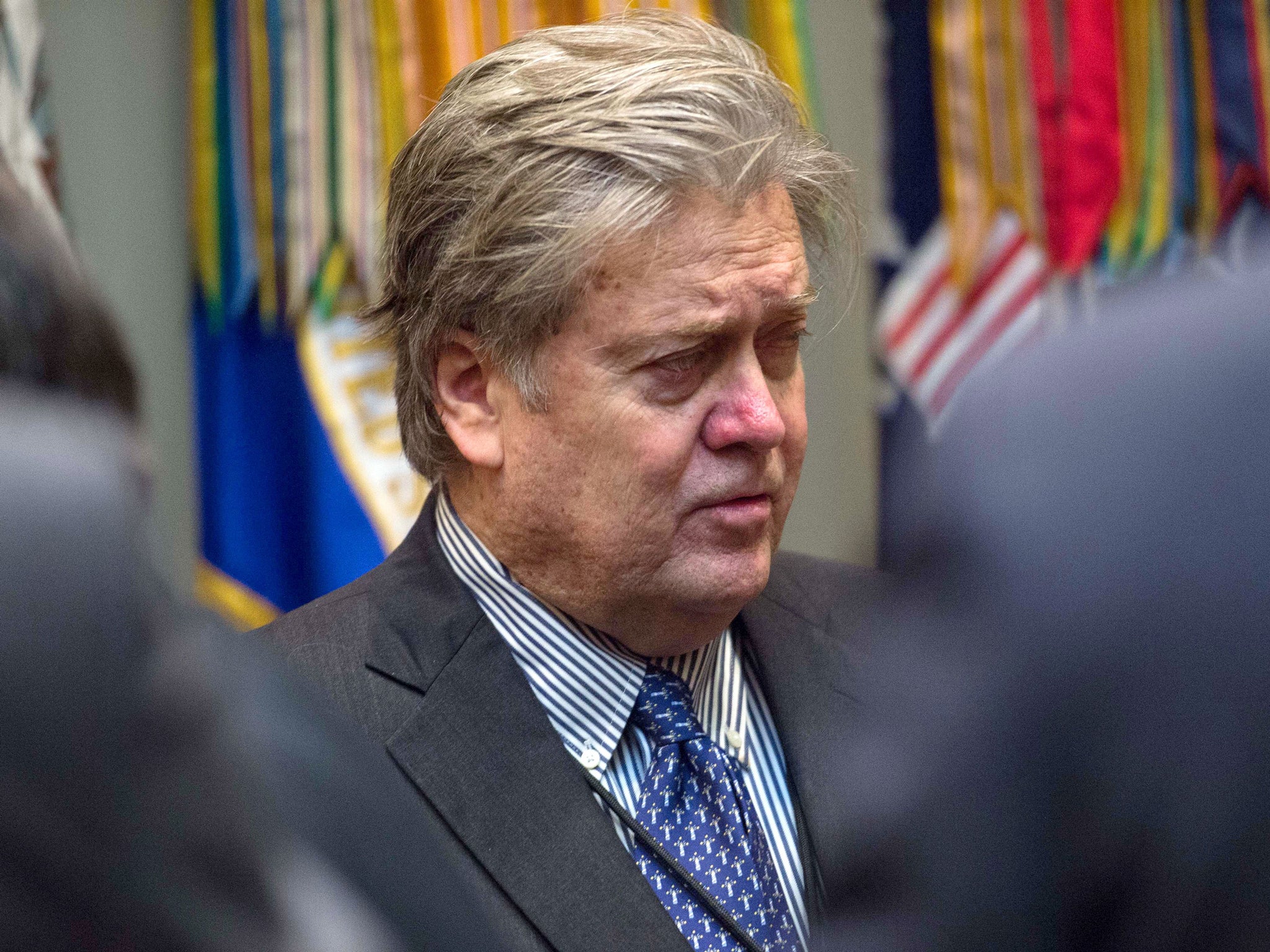 Bannon waits for the start of Trump's meeting with business leaders in Roosevelt Room at the White House