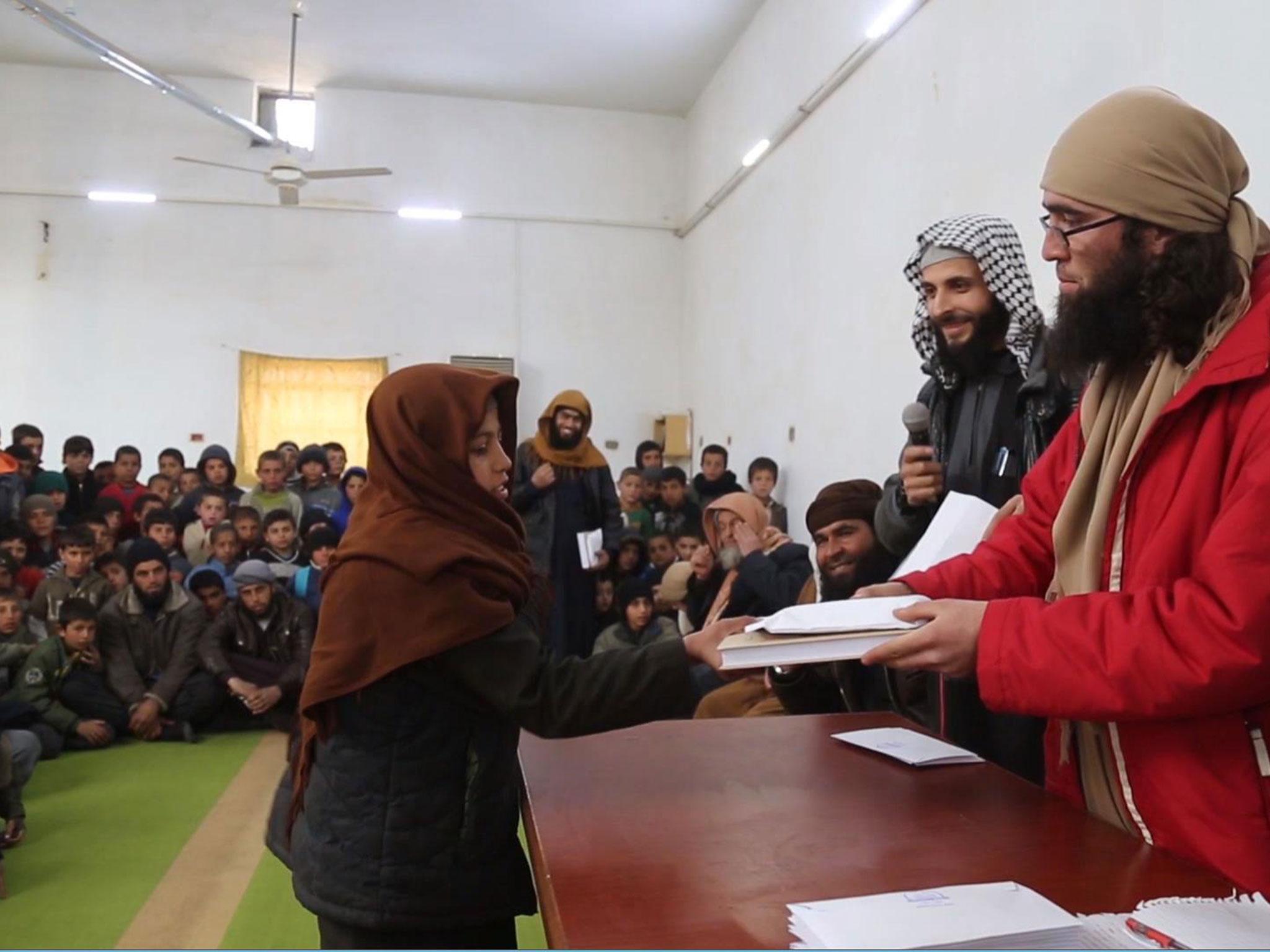 An Isis propaganda video showing boys being rewarded by jihadis for memorising the Quran in Syria