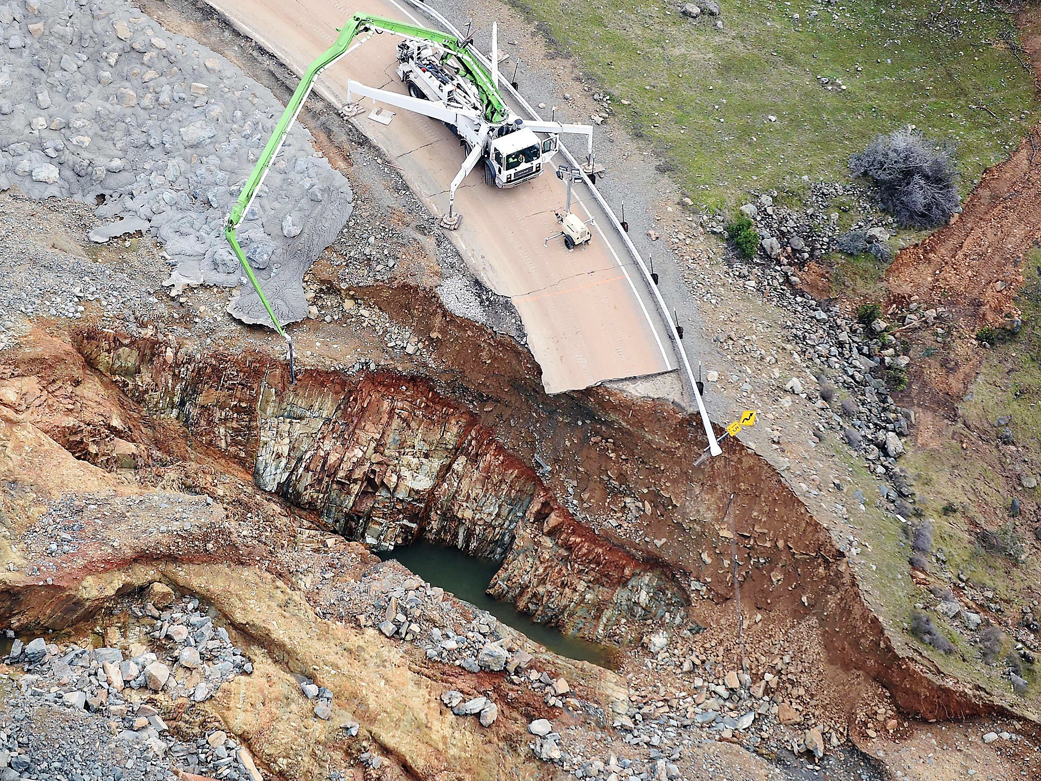 Crews work on a damaged section of the Oroville Dam in Oroville, California