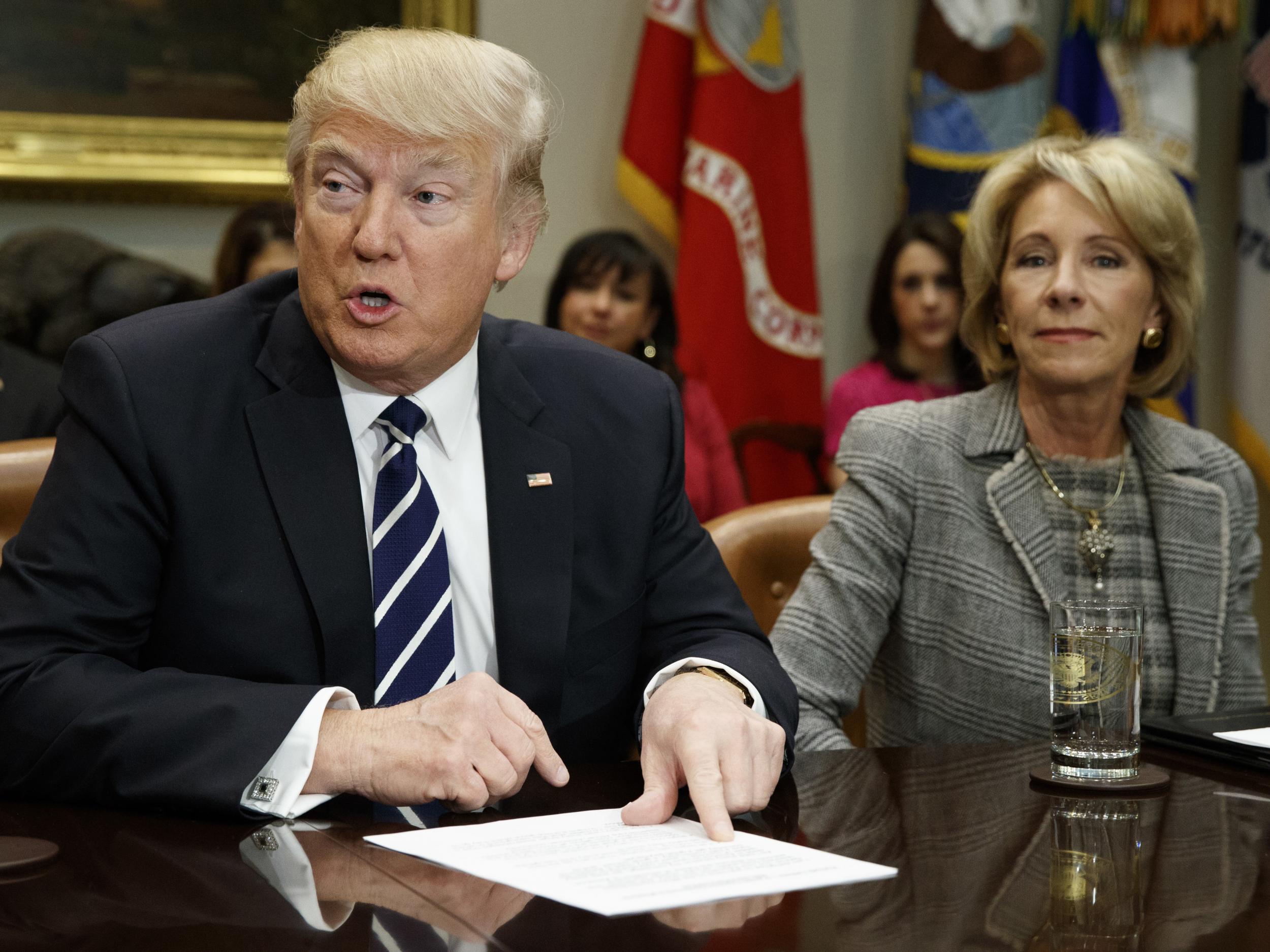 Donald Trump and Education Secretary Betsy DeVos at a White House meeting with parents and teachers