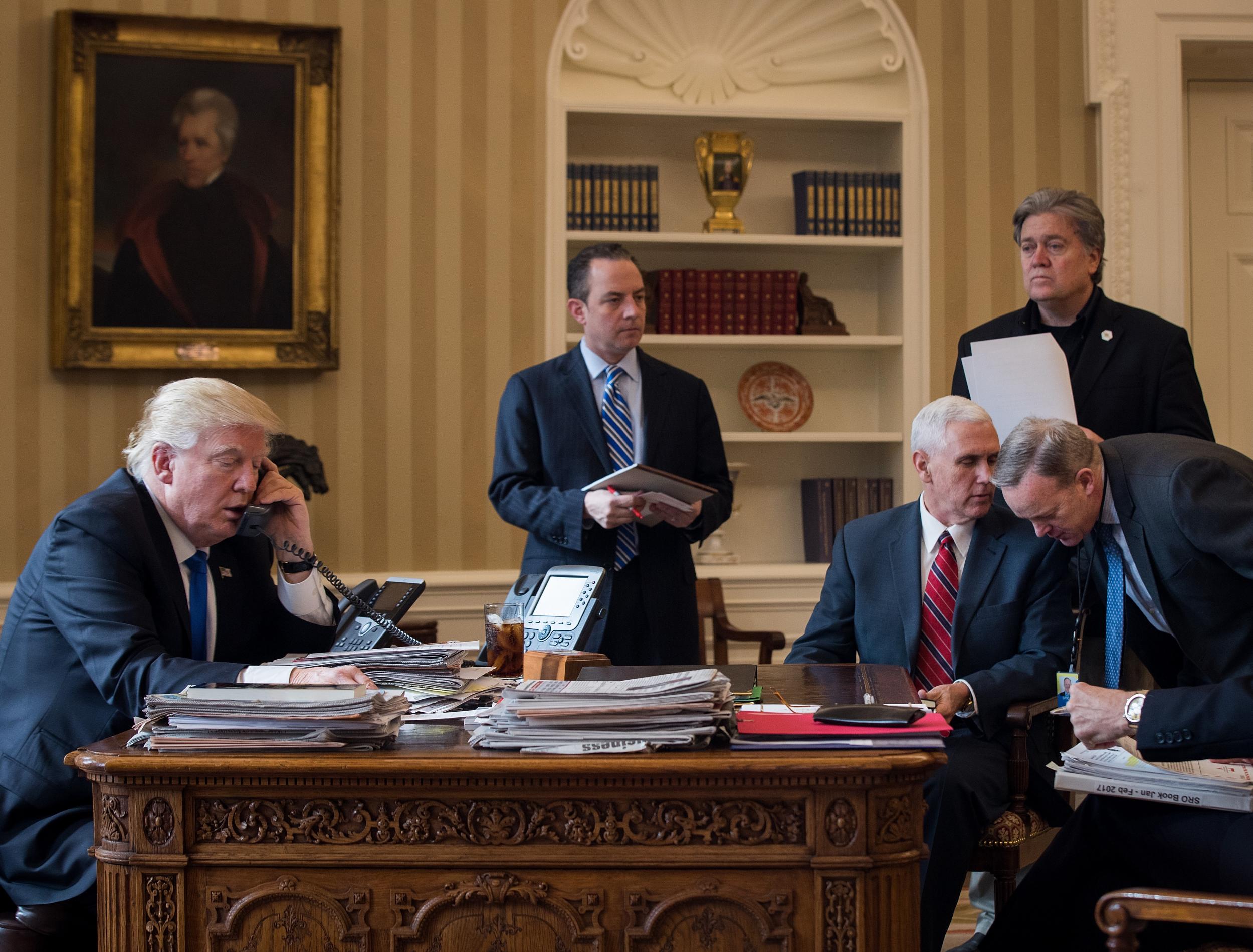 President Donald Trump speaks on the phone with Russian President Vladimir Putin in the Oval Office of the White House (Getty Images)