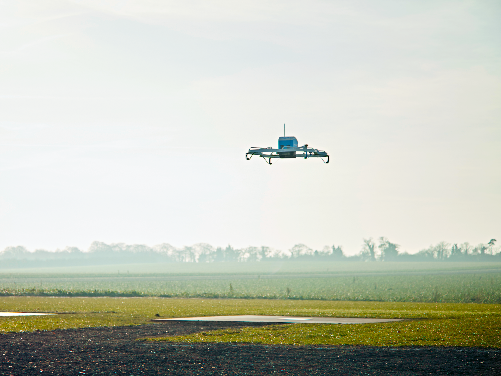 The drones could use magnets, parachutes or spring coils to release packages mid-flight