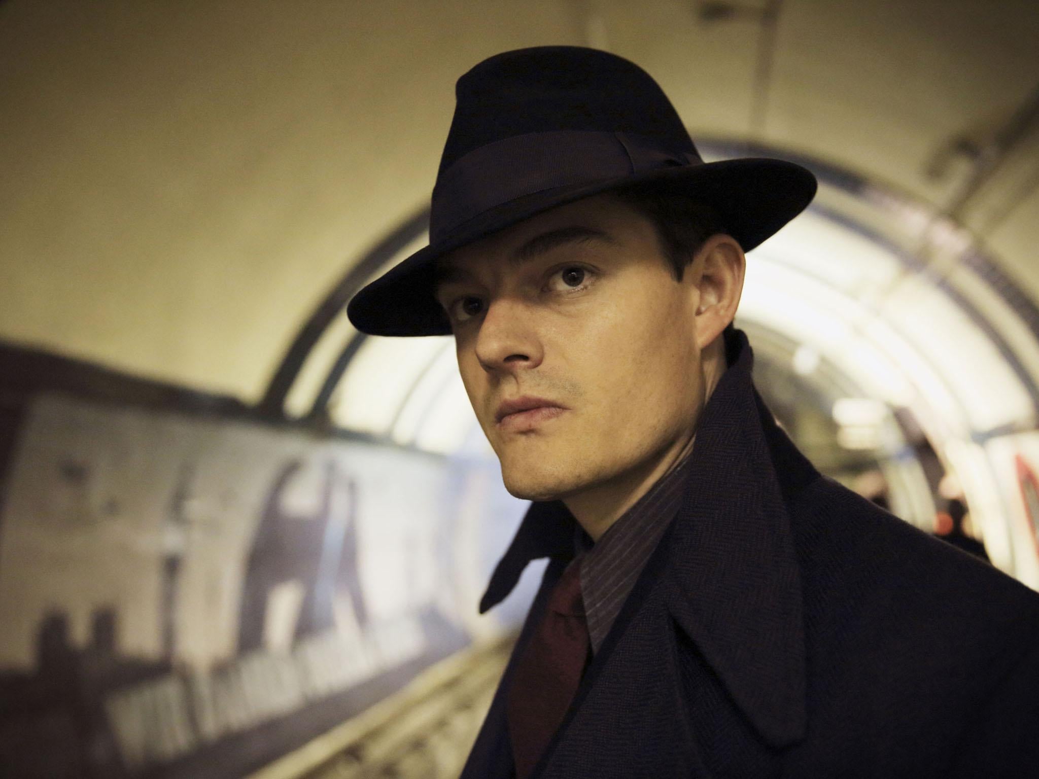 Sam Riley plays Douglas Archer, a Scotland Yard police detective who works for the Gestapo