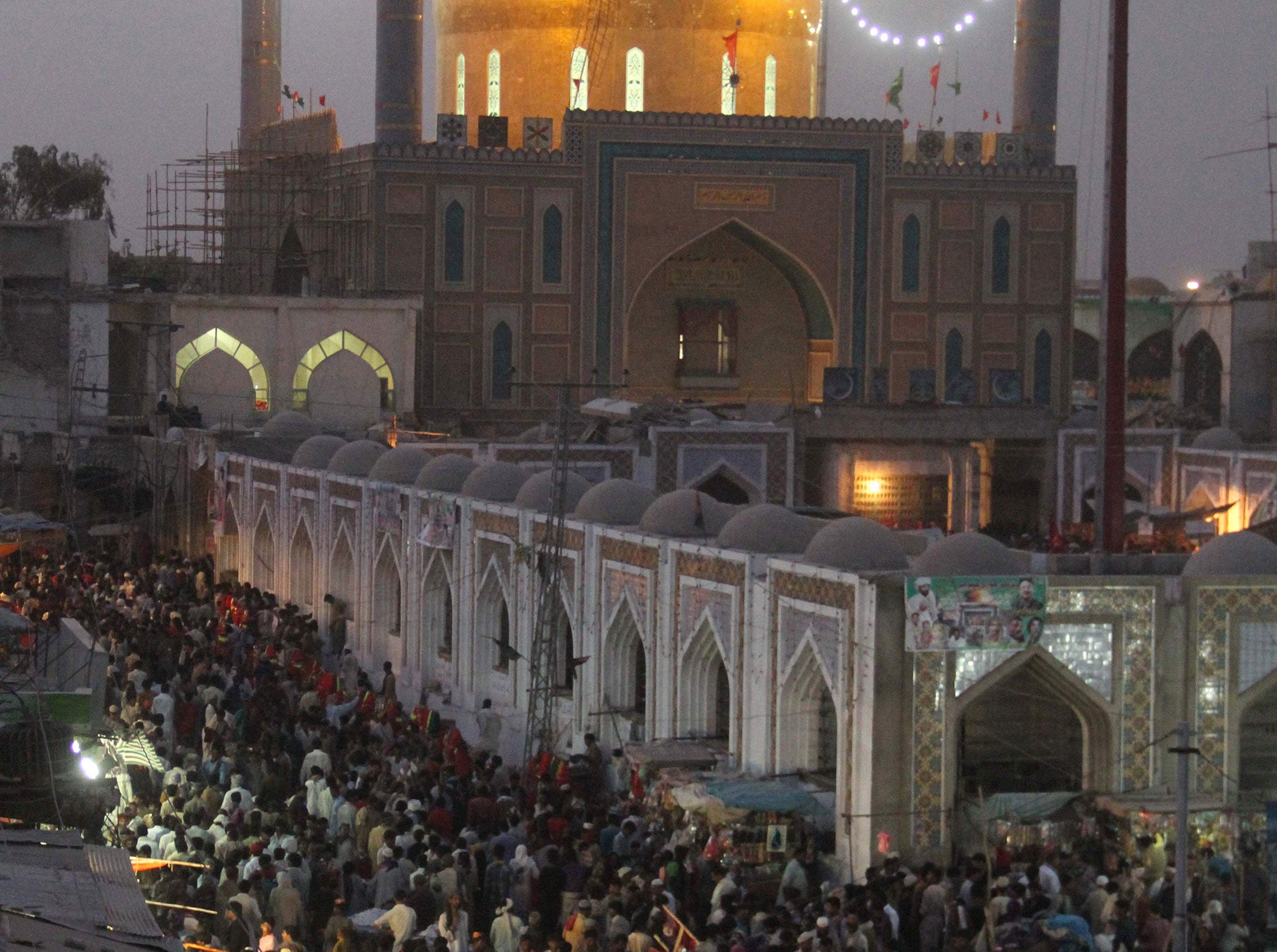 Pakistani devotees gather at the shrine of 13th century Sufi philosopher Lal Shahbaz Qalandar in Sehwan, in June 2014