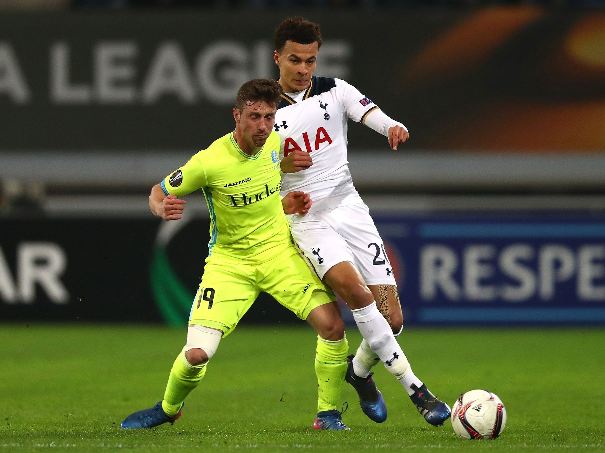 Brecht Dejaegere and Dele Alli tussle for possession