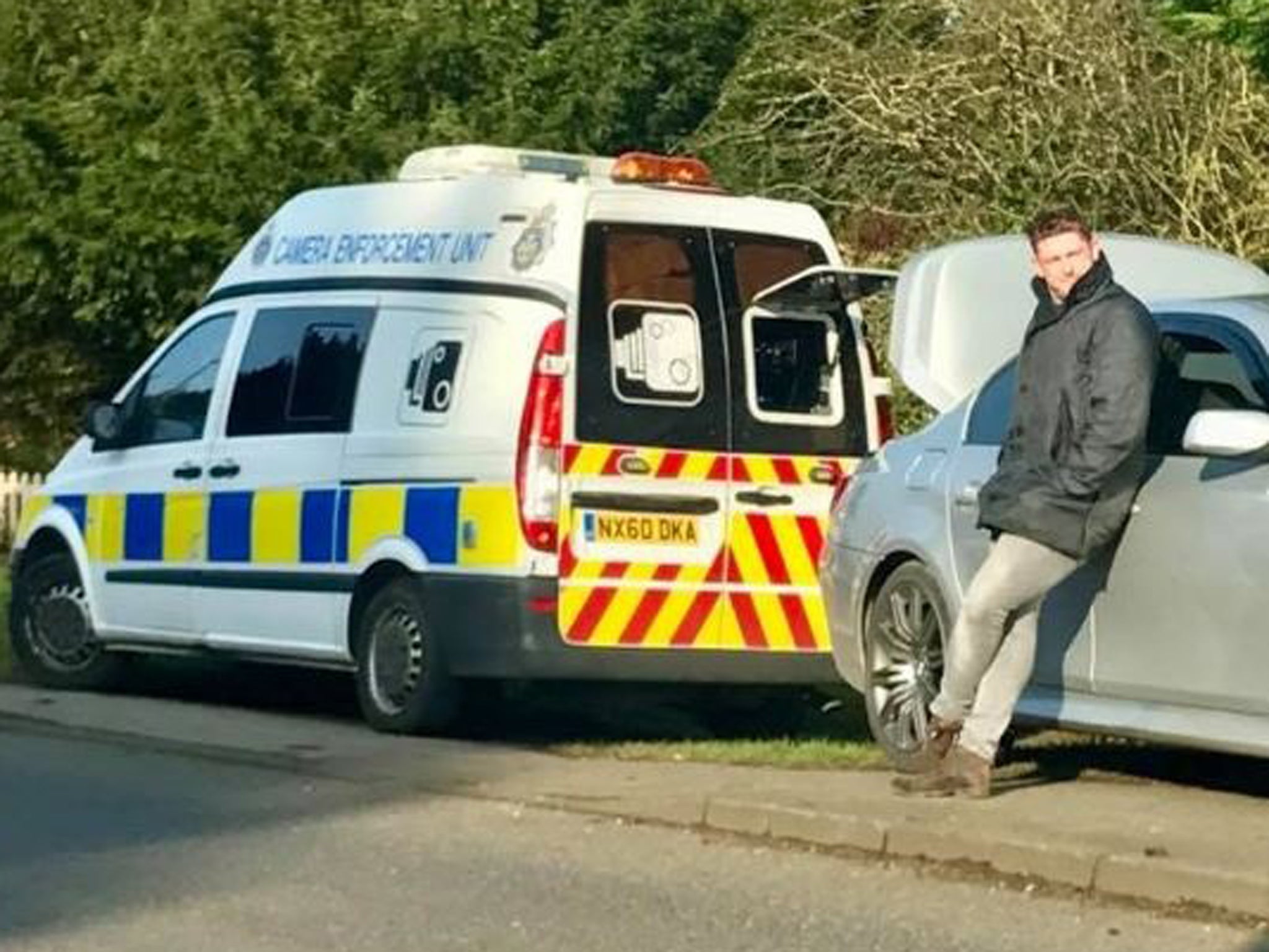 Chris Welford parked his BMW a few feet behind a police van, lifted up his bonnet and blocked the camera