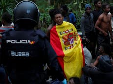 Hundreds of migrants scale 20ft fence into Spanish enclave of Ceuta as refugee route shifts