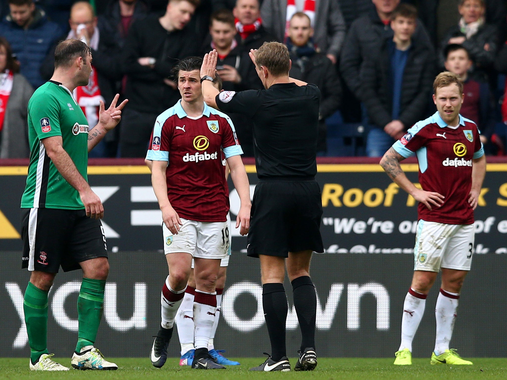 &#13;
Joey Barton was shown a yellow card for his altercation with Lincoln's Bradley Wood &#13;