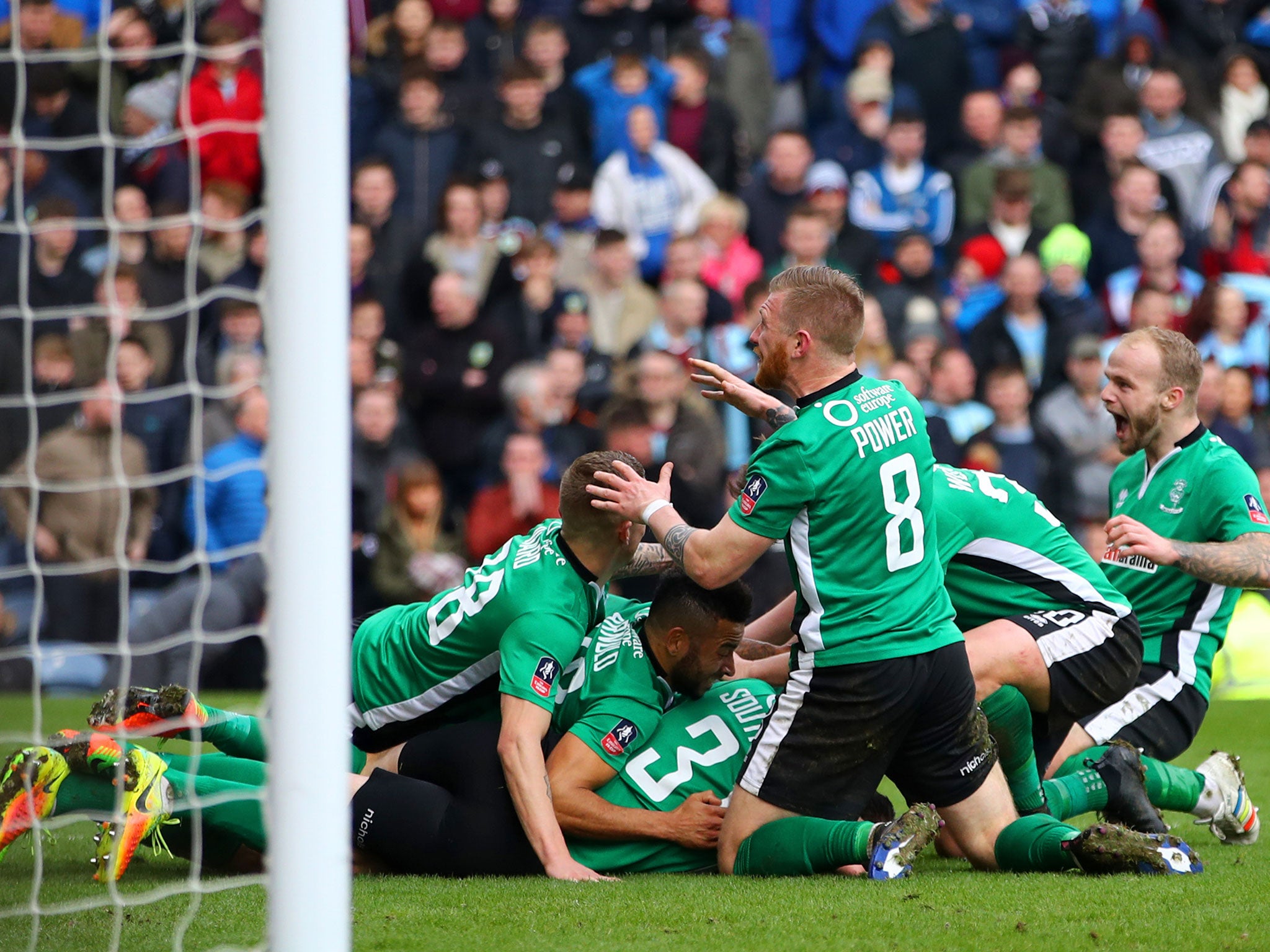 Lincoln's players celebrate after Raggett's late winner