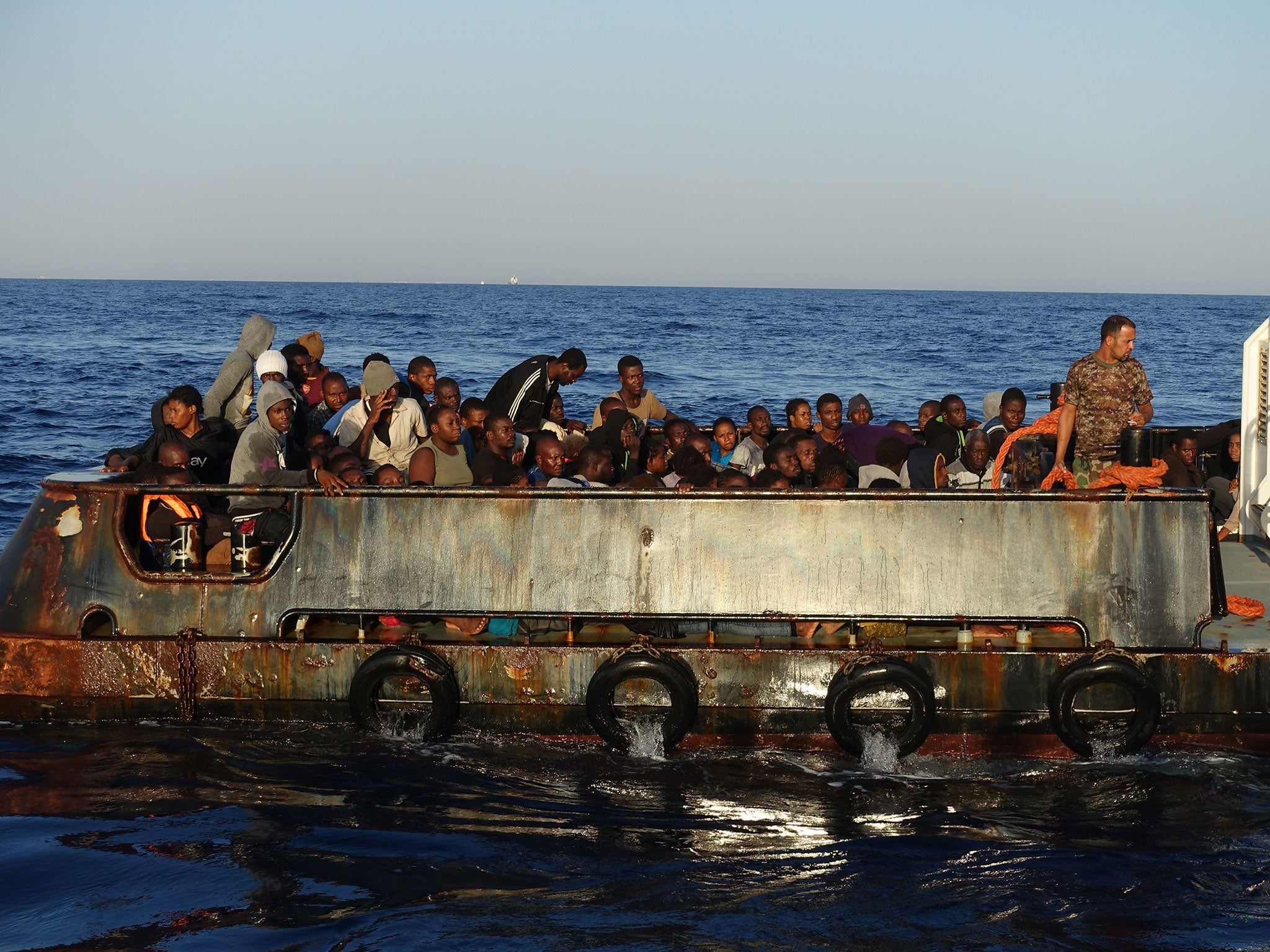 Migrants on a Libyan coastguard boat off the coast of Zuwiyah in September 2016