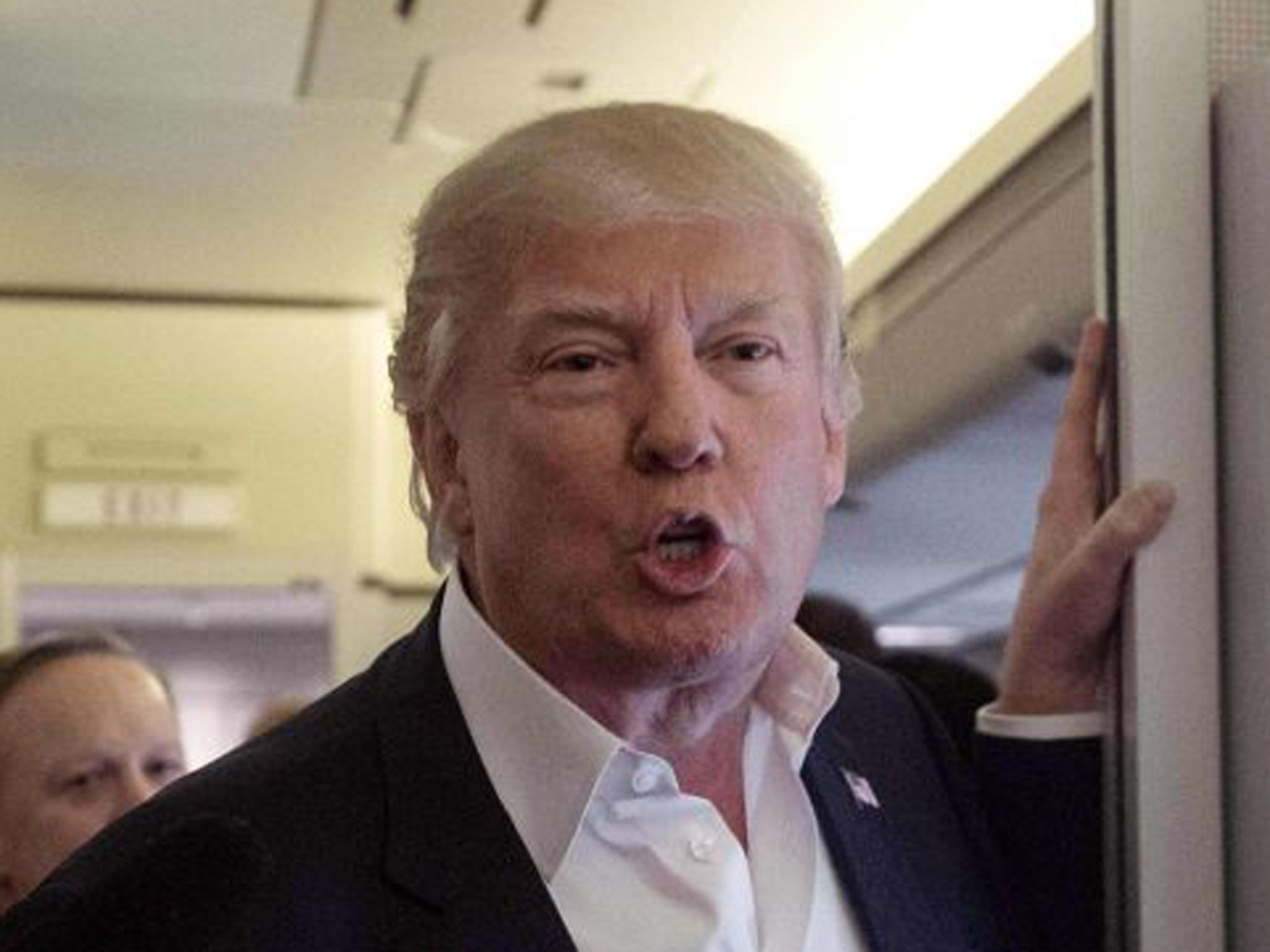 US President Donald Trump speaks to the press aboard Air Force One before addressing a rally in Melbourne, Florida