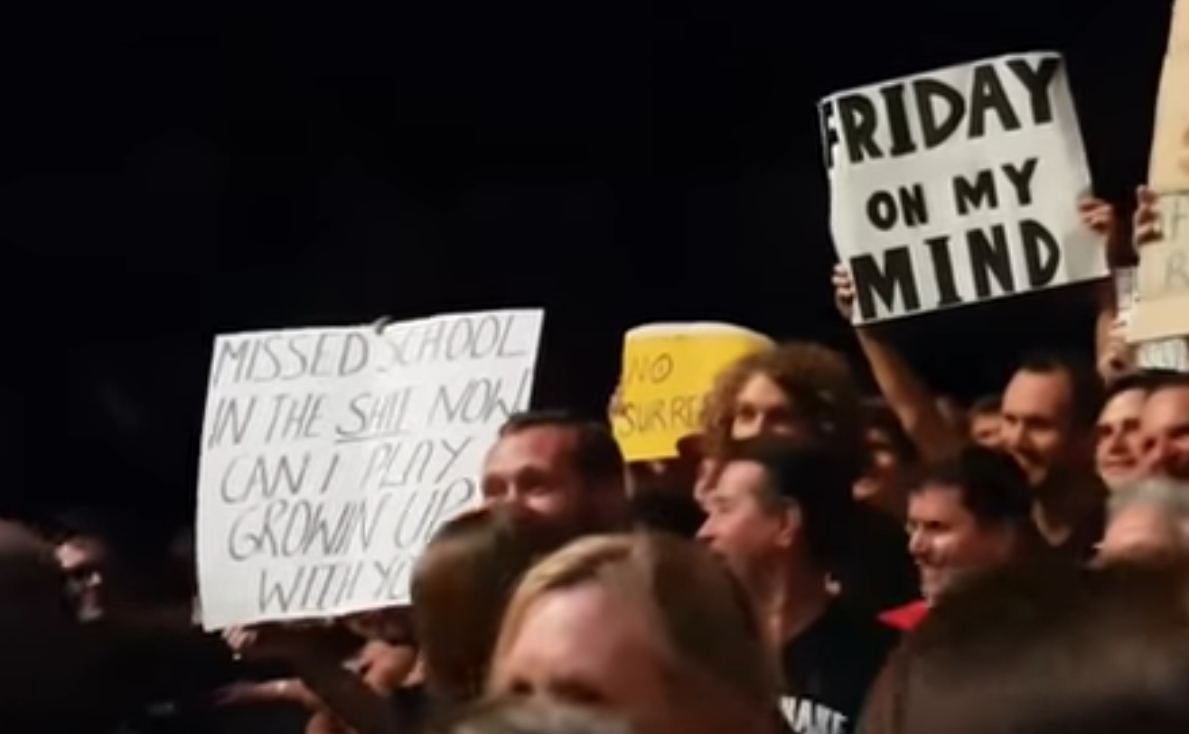 The sign [far left] the young fan was waving to get Springsteen's attention