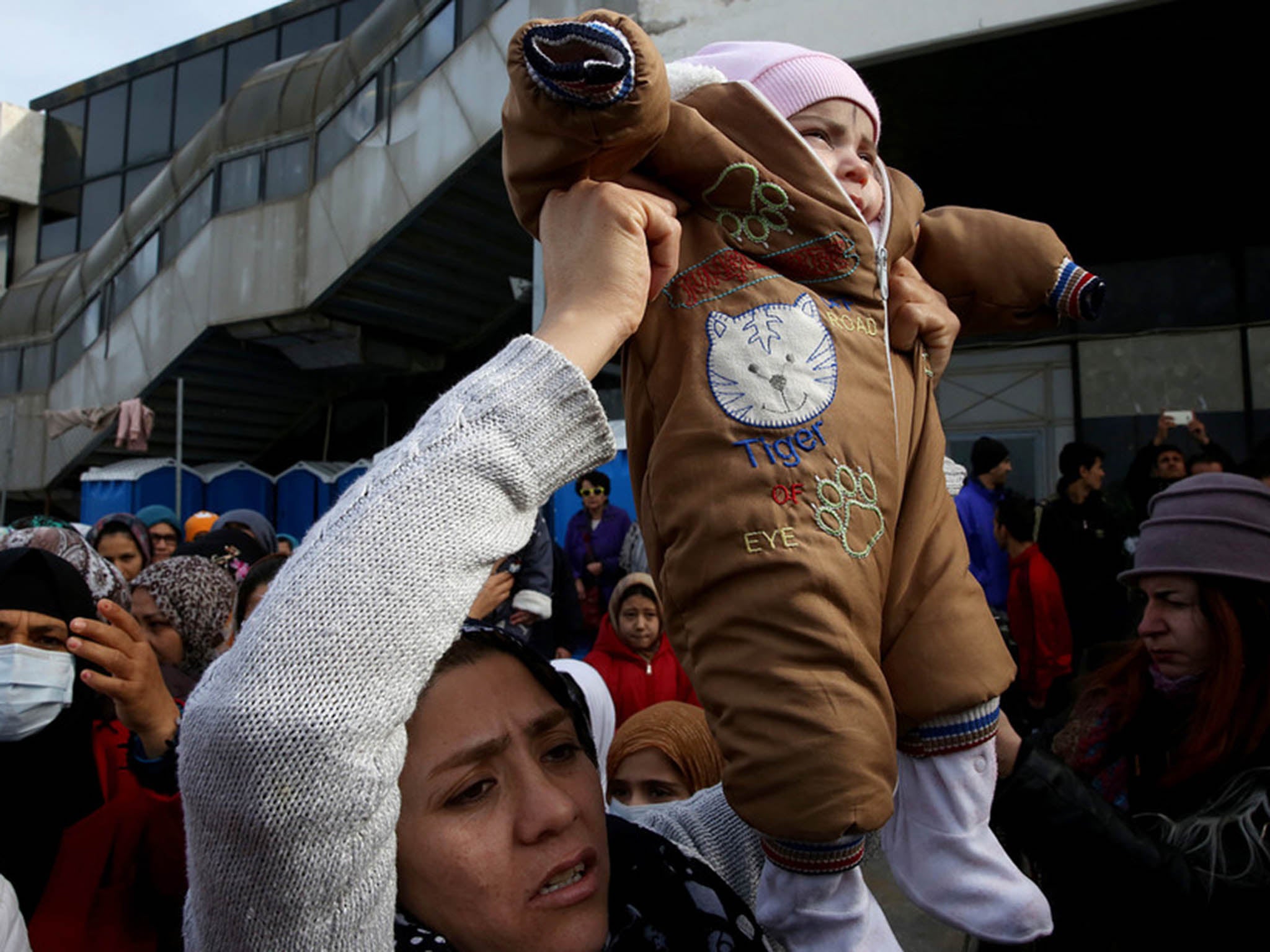 Afghans protest at a refugee camp in Athens in early February