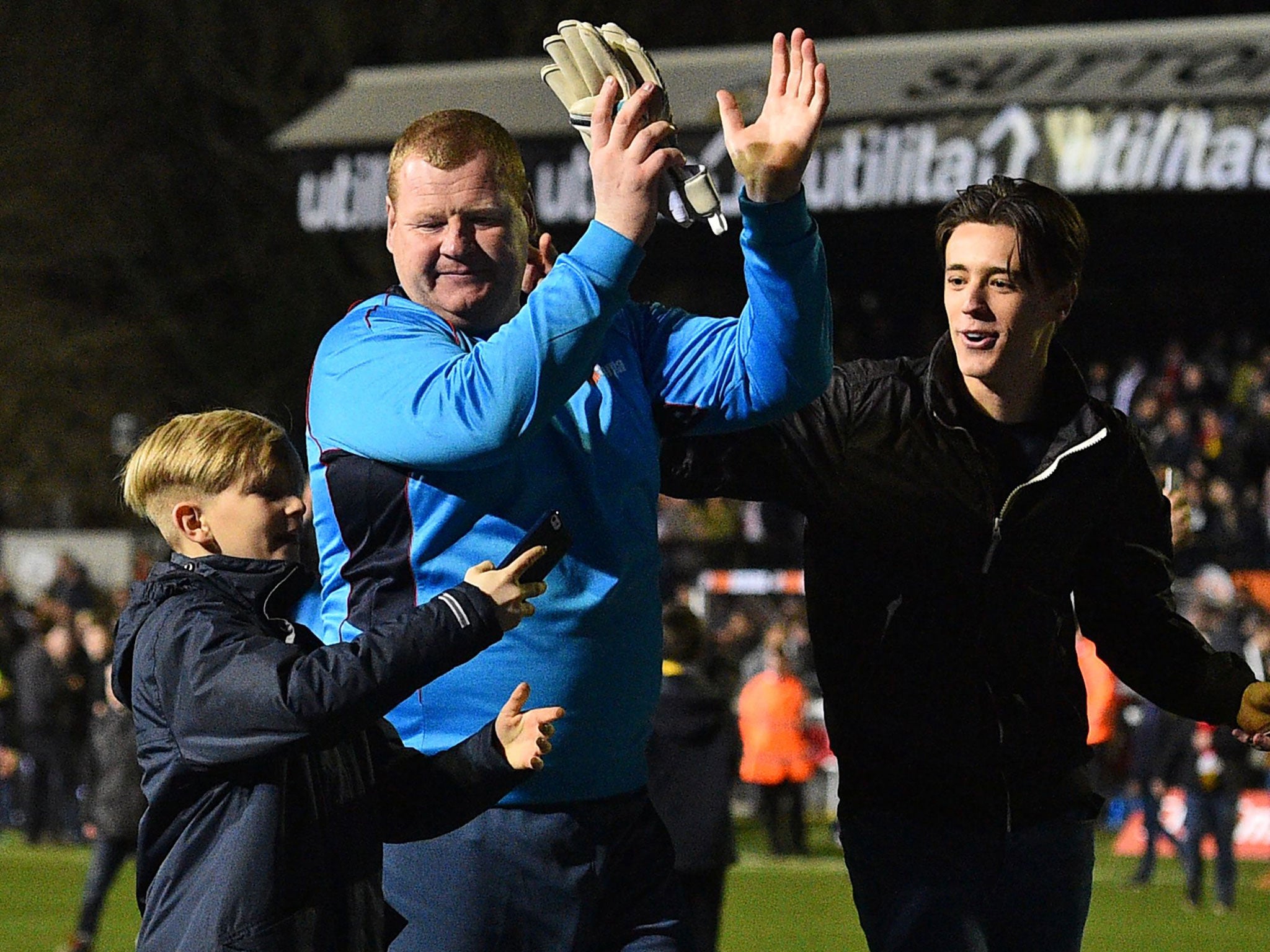 Shaw with fans after the final whistle at Gander Green Lane